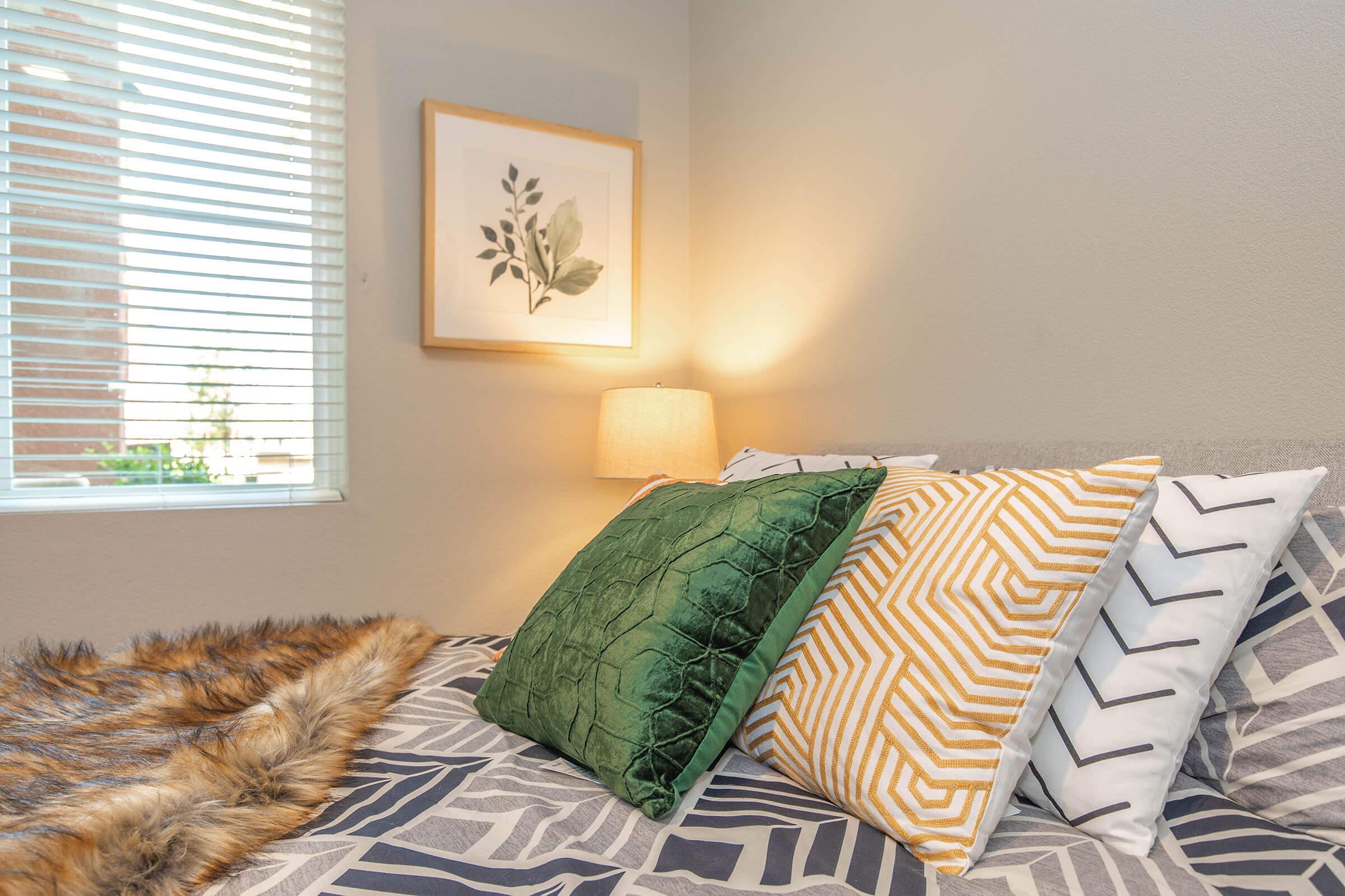 a cat sleeping on top of a bed