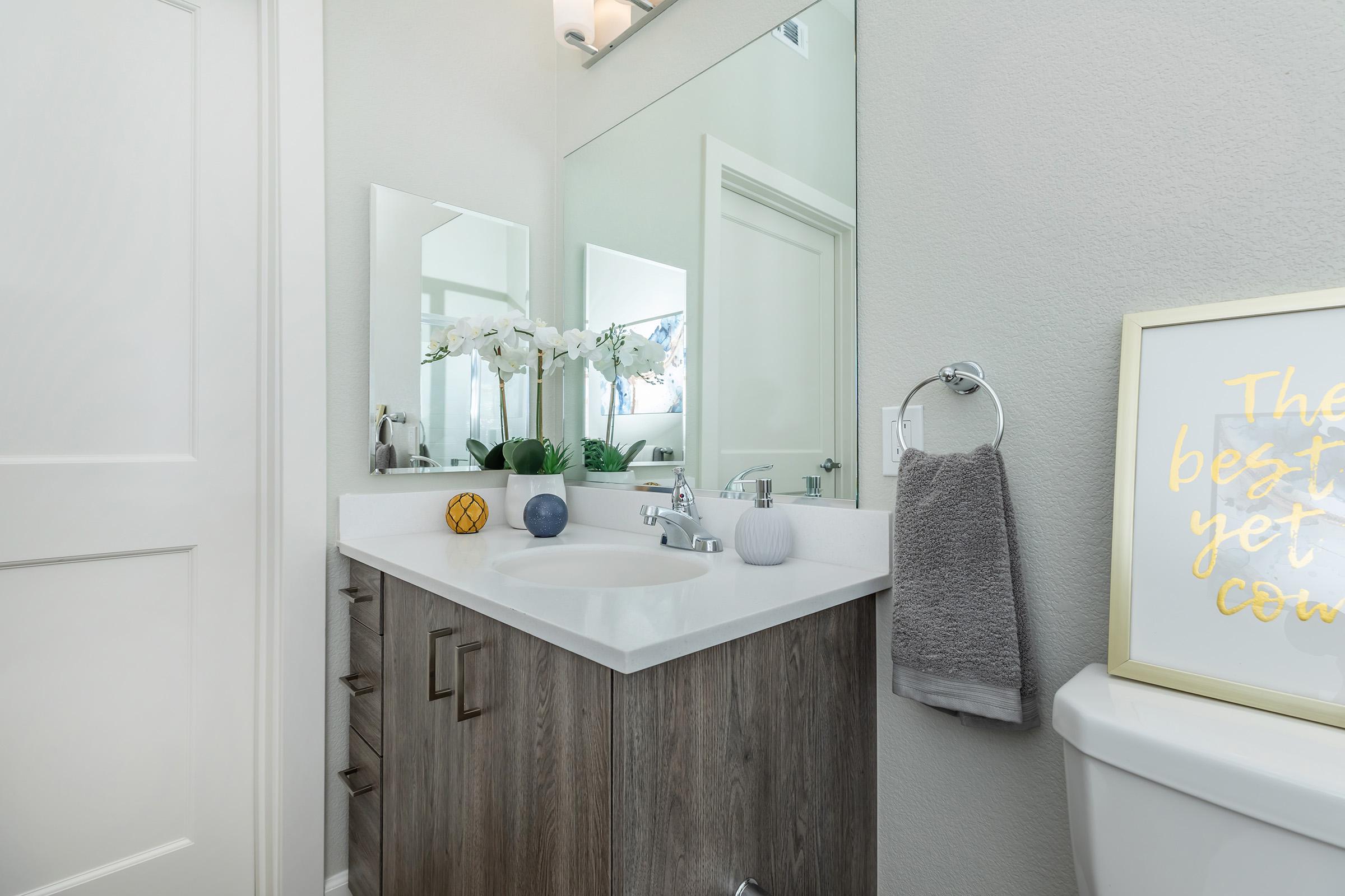 a room with a sink and a mirror