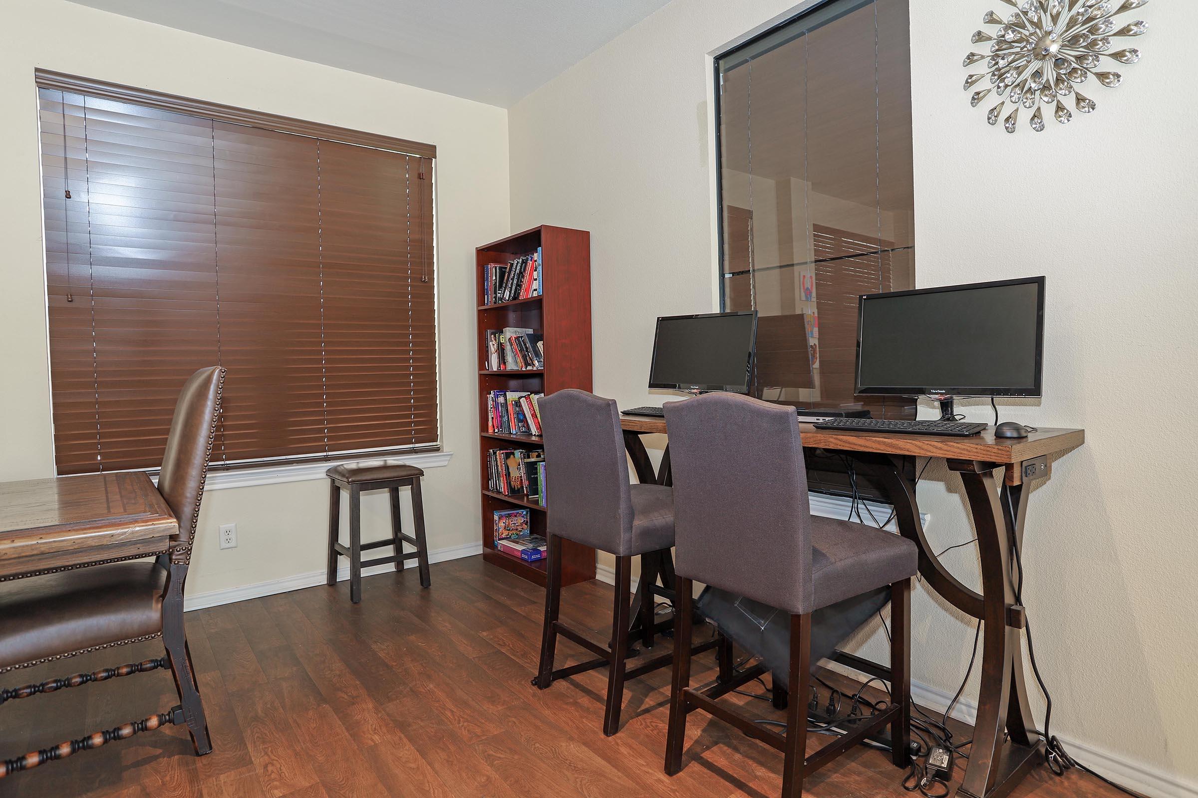 a living room filled with furniture and a tv