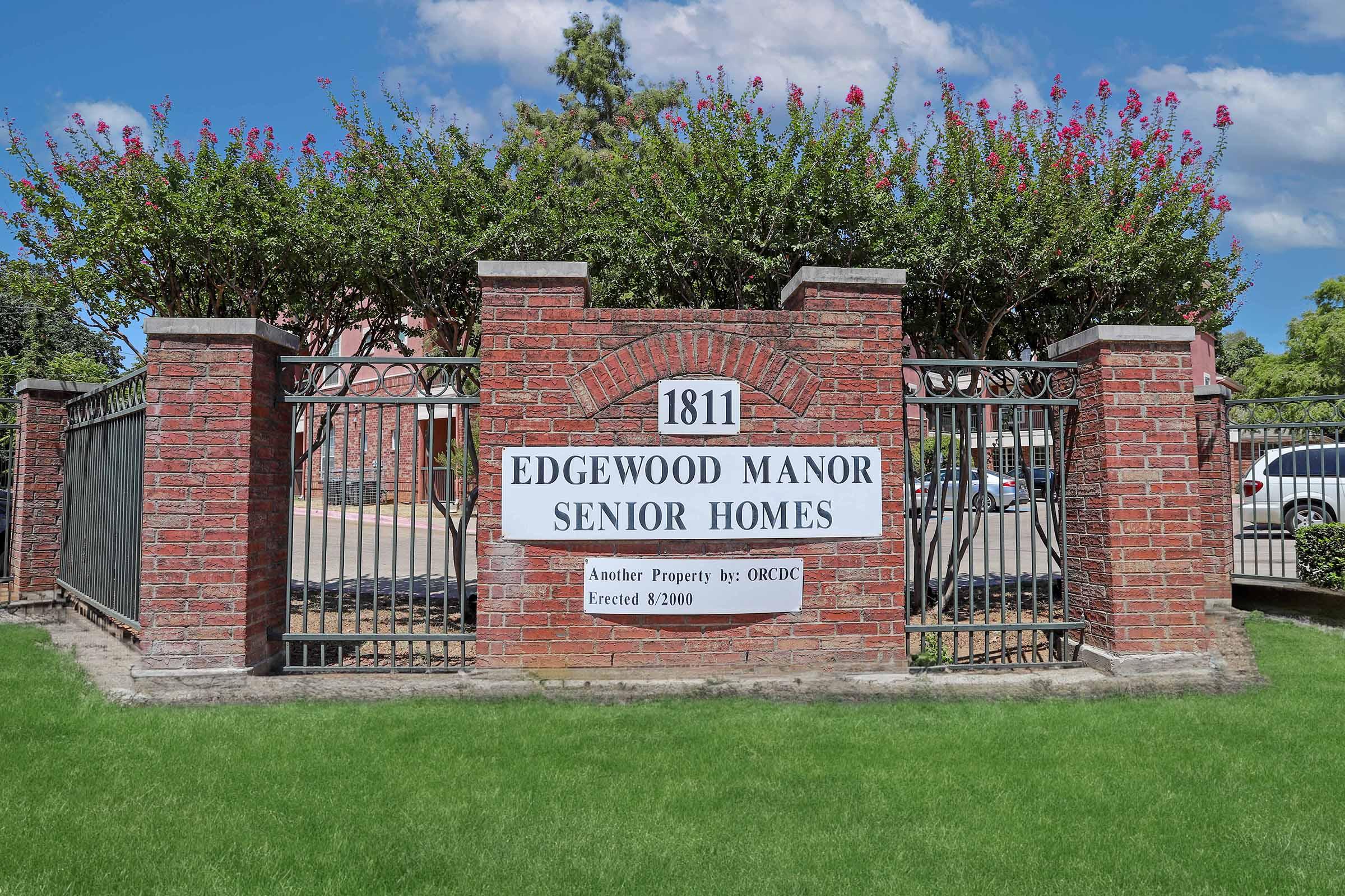 a sign in front of a house