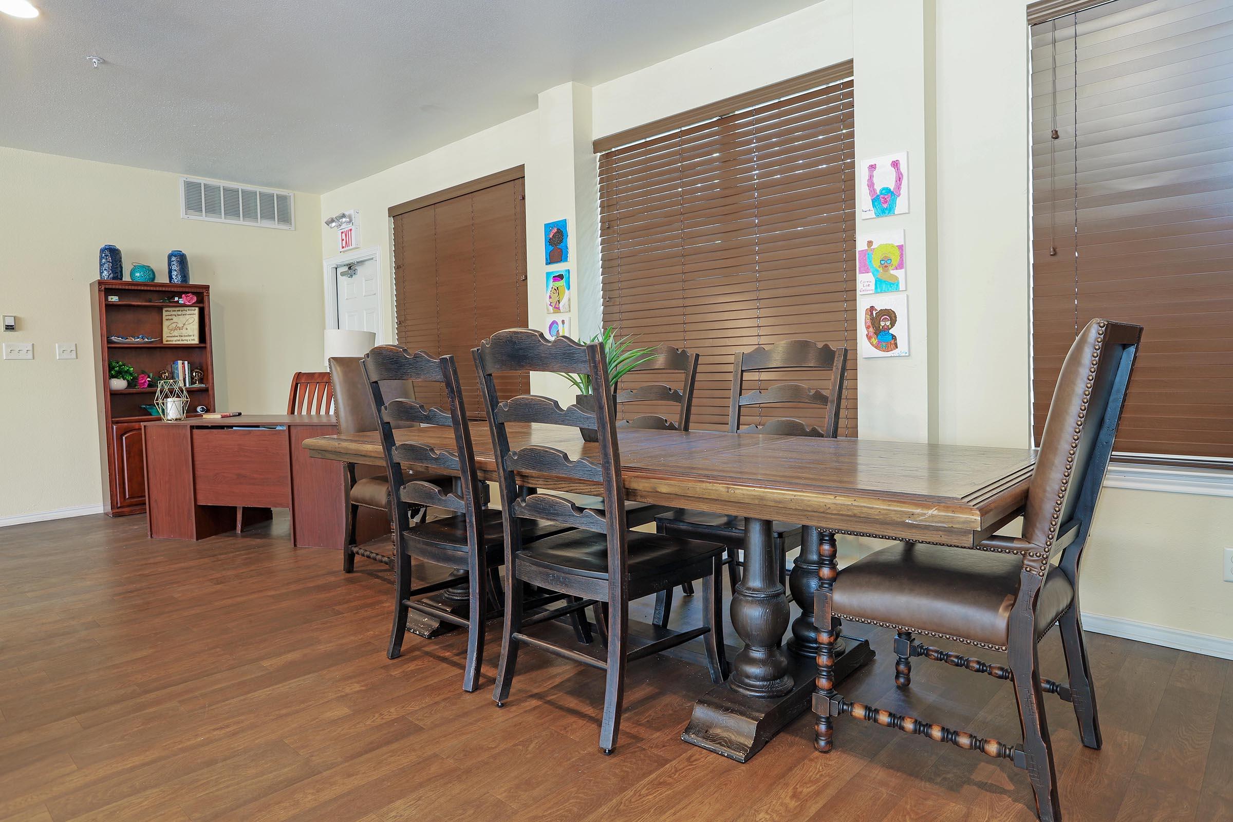 an office with a desk and chair in a room