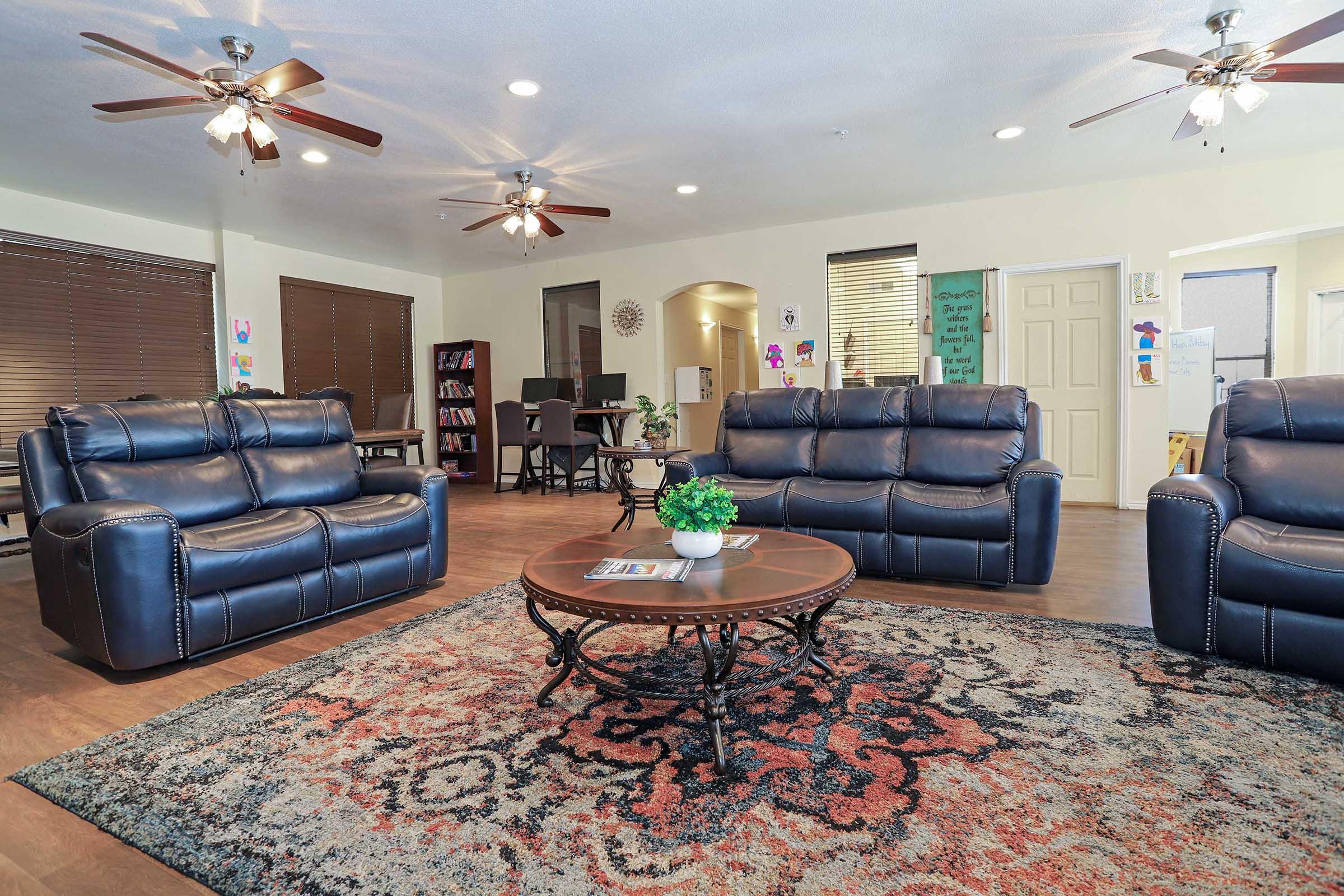 a living room filled with furniture and a flat screen tv