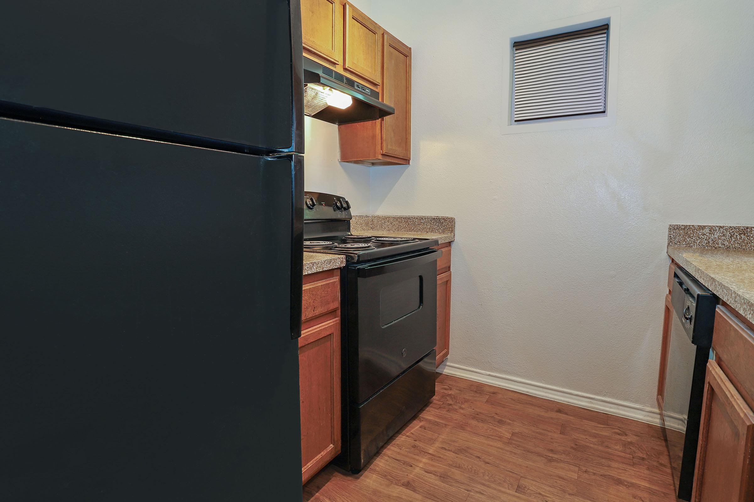 a kitchen with a stove top oven sitting inside of a refrigerator