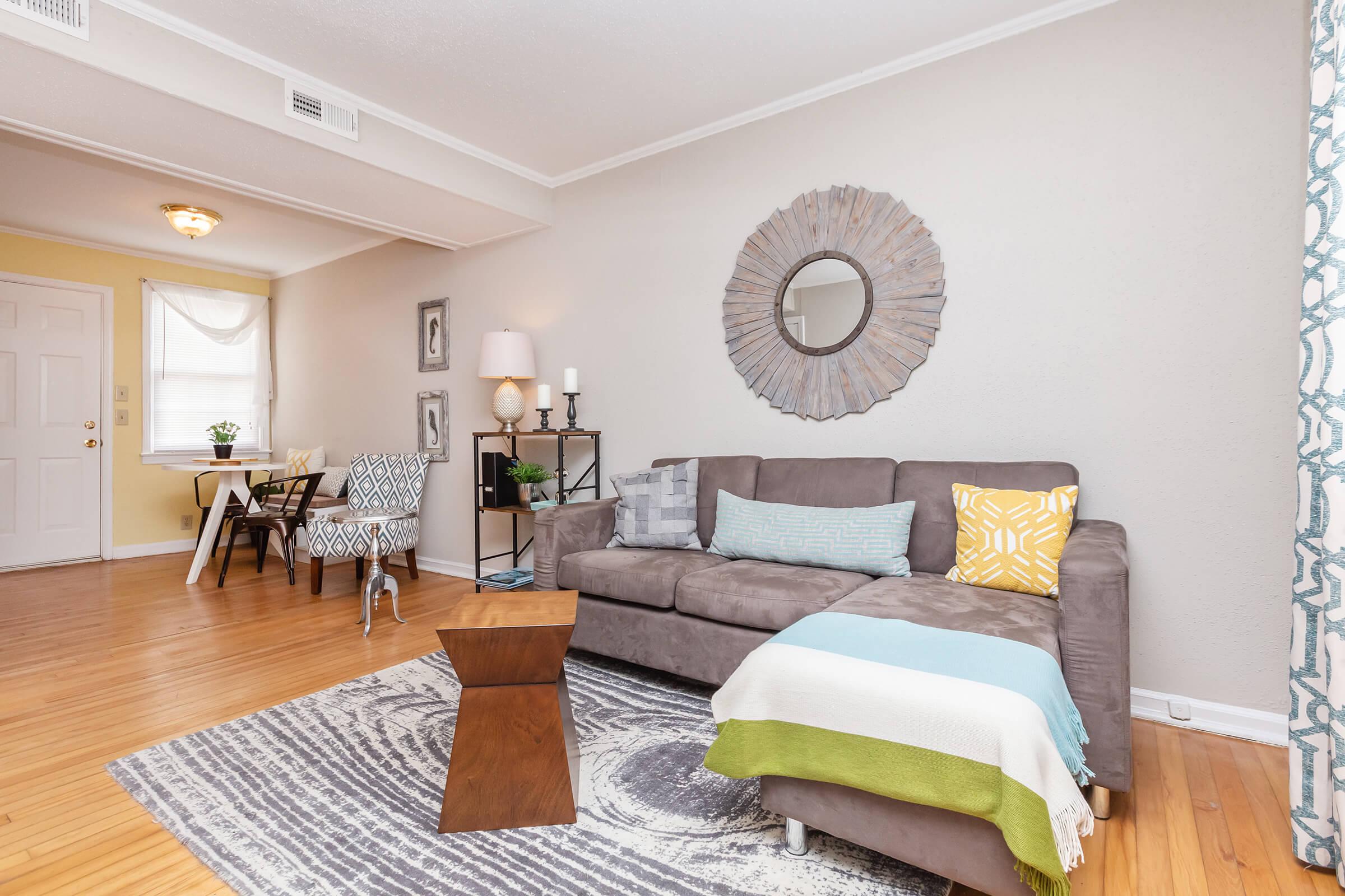 a living room filled with furniture and a fireplace