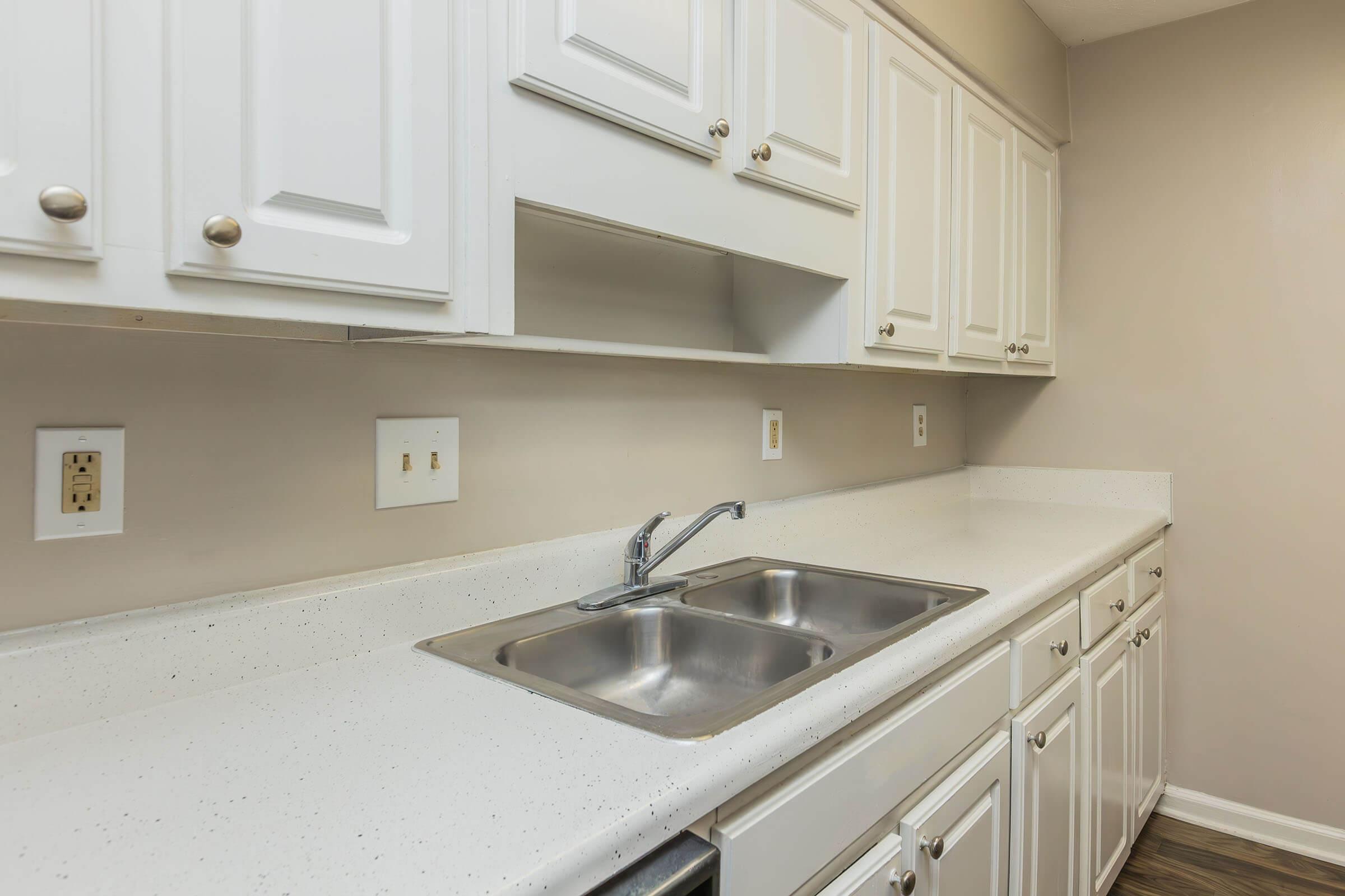 a kitchen with a sink and a microwave