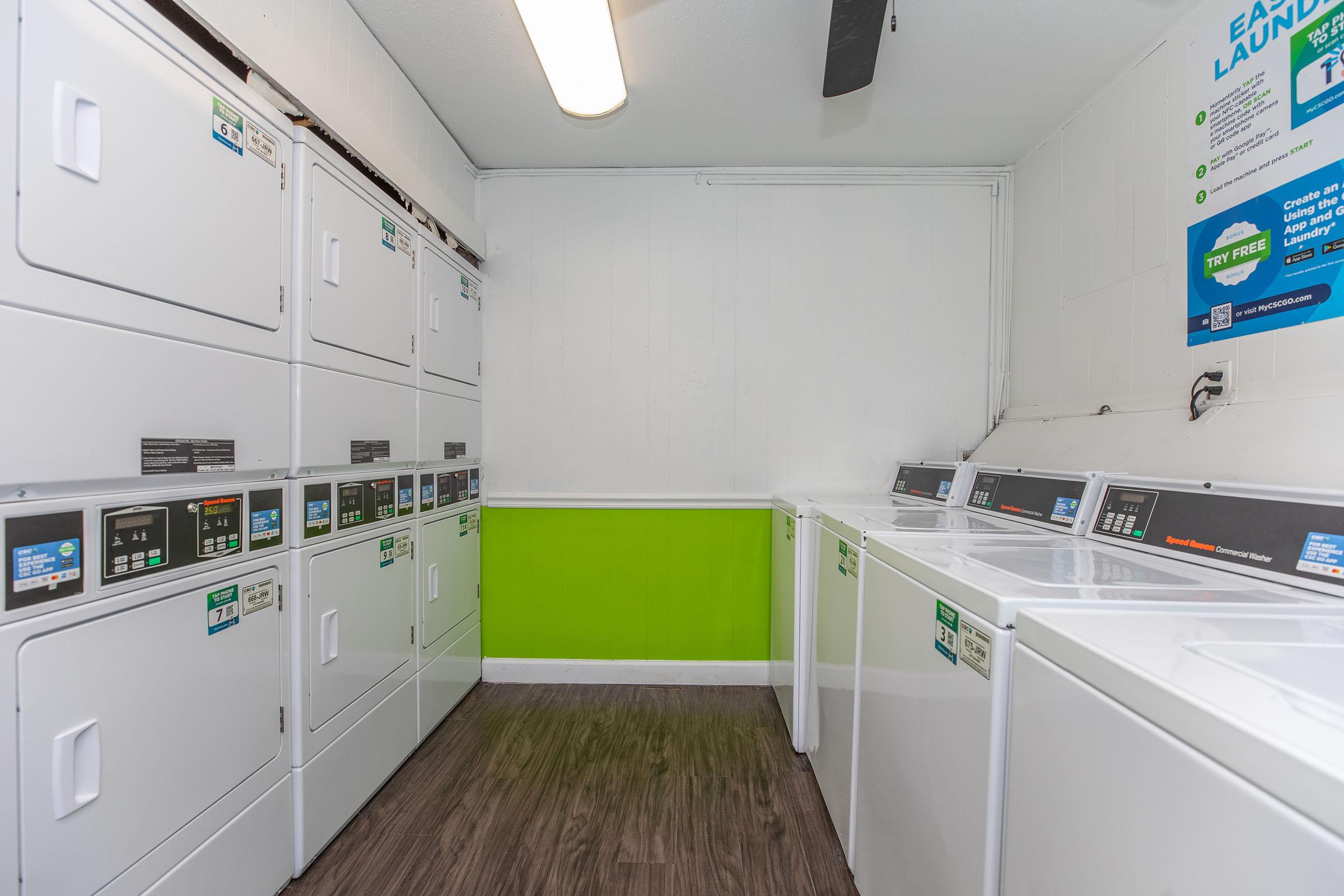 a kitchen with green walls