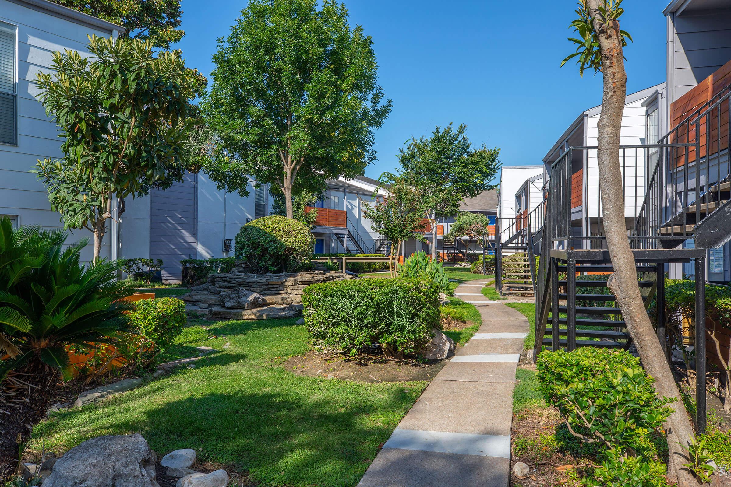 a garden in front of a building