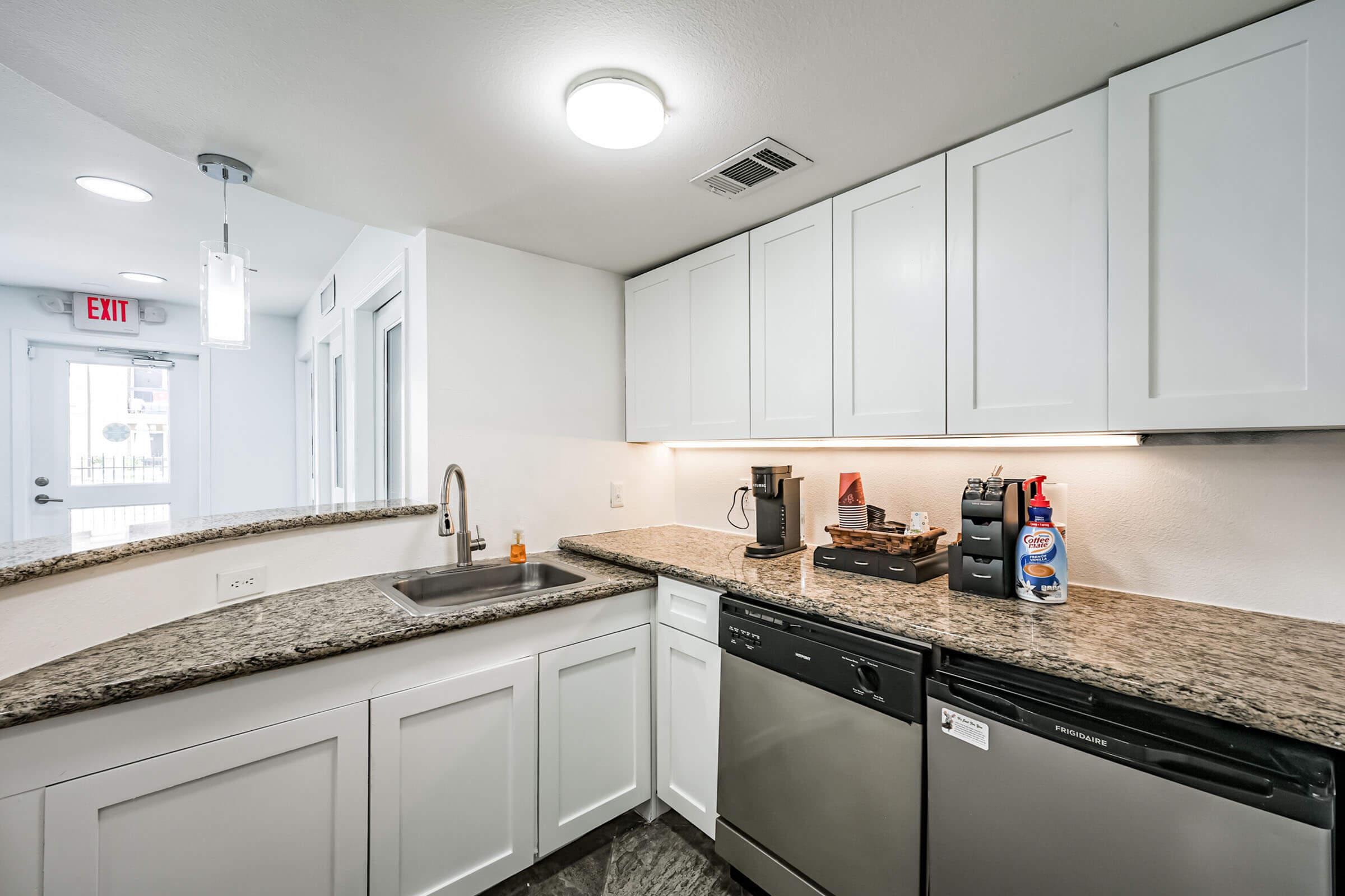 a kitchen with a stove and a sink