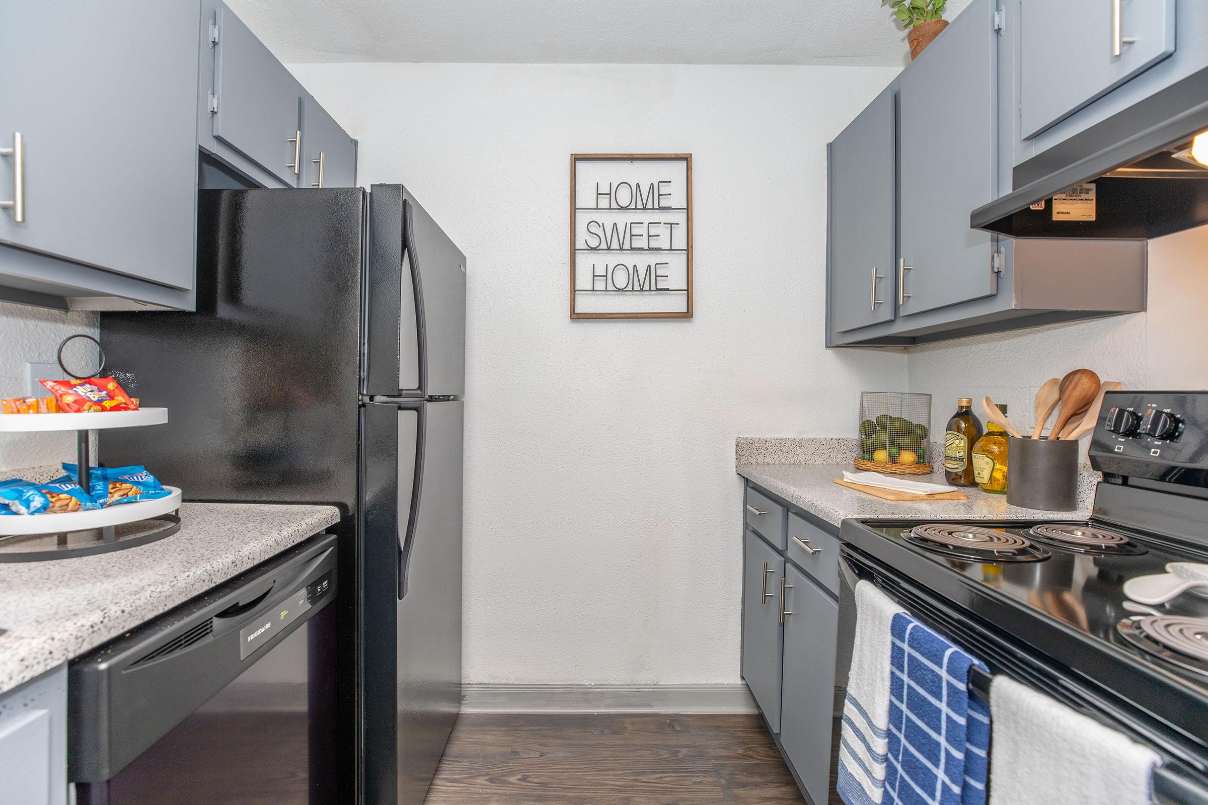 a stove top oven sitting inside of a kitchen counter