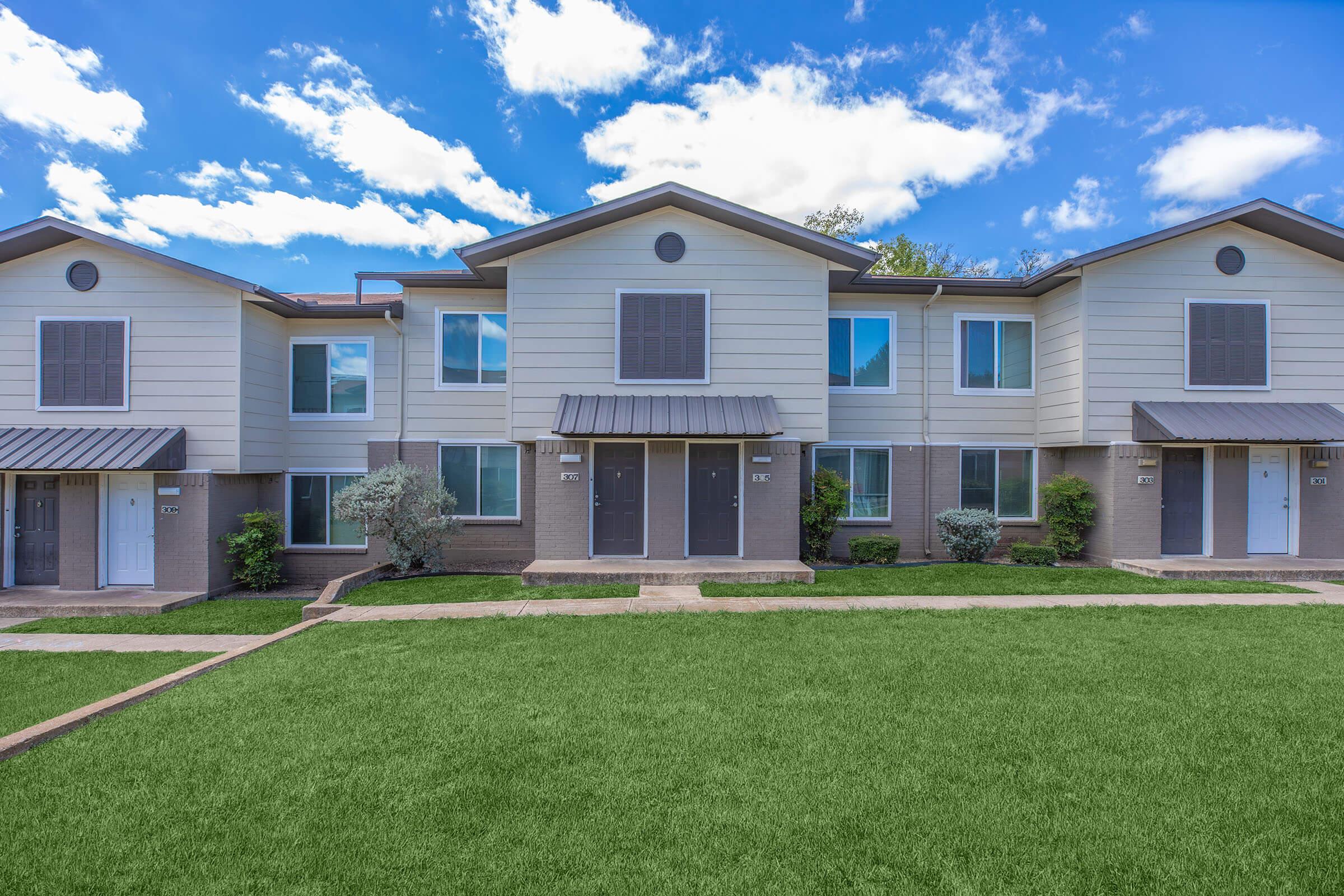 a large lawn in front of a house