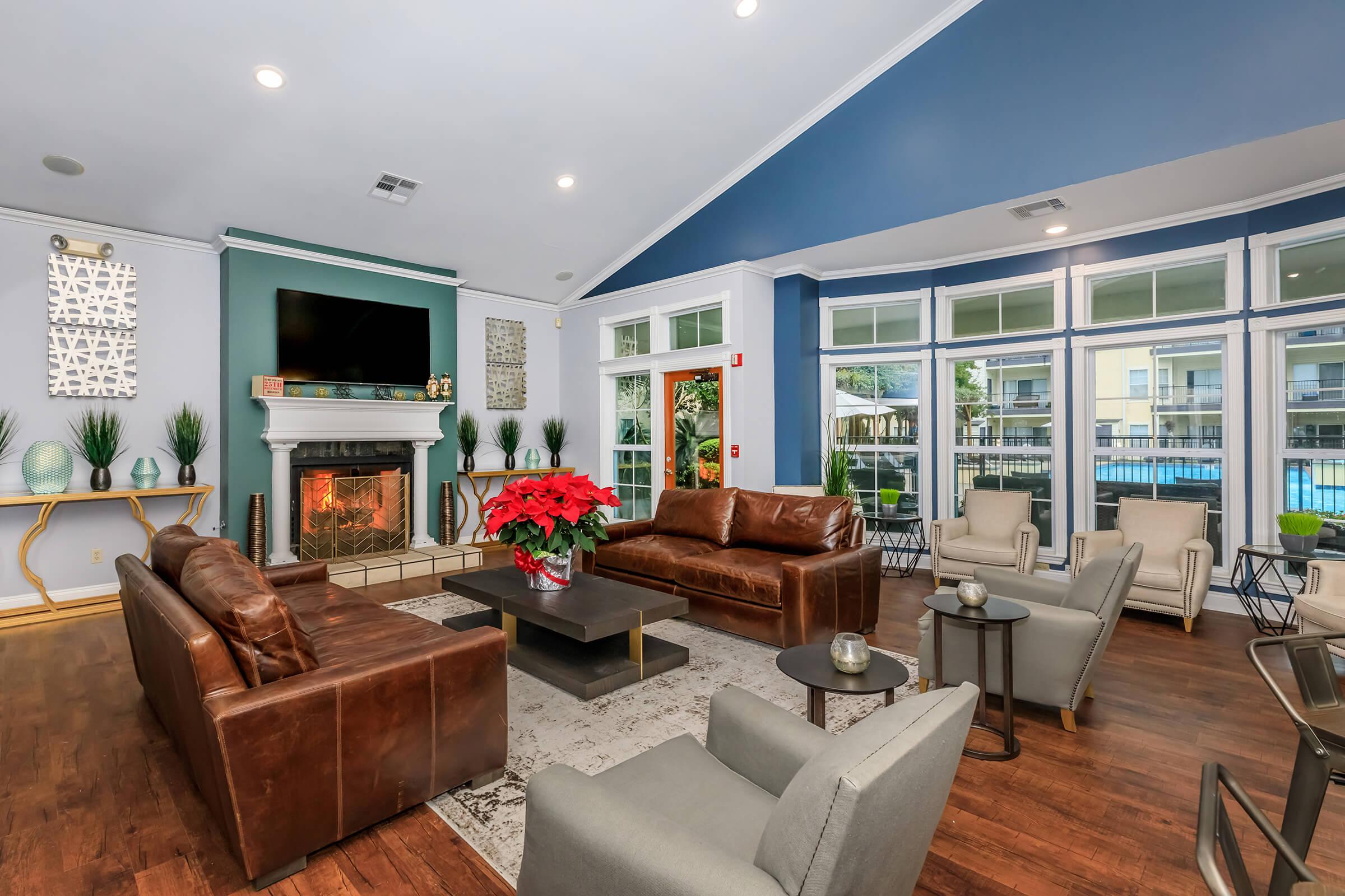 a living room filled with furniture and a fire place