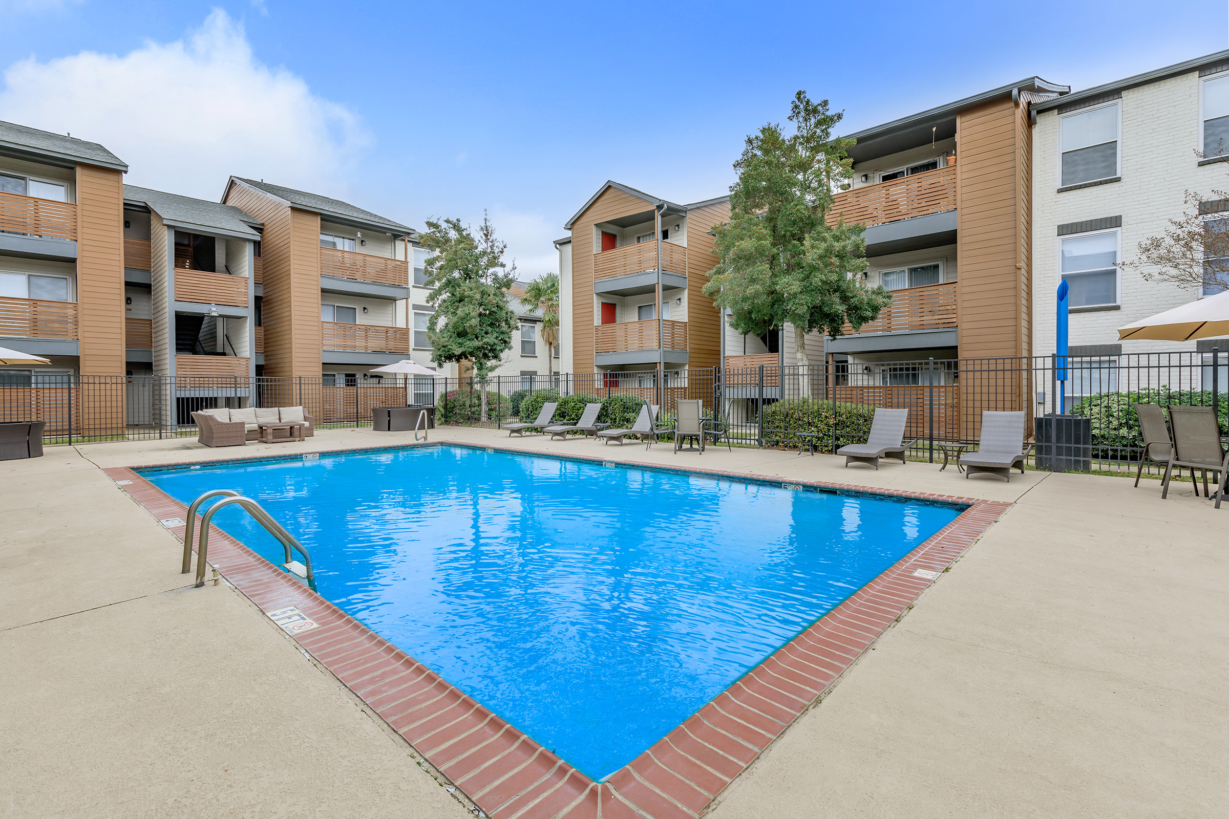 a house with a pool outside of a building