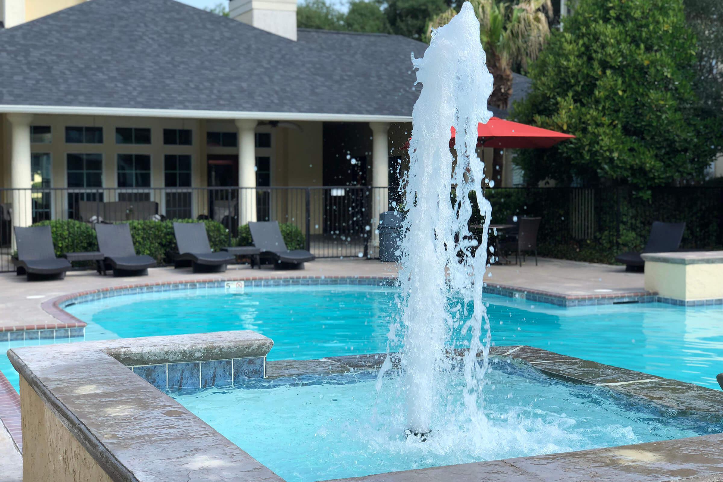 a fountain in a pool of water