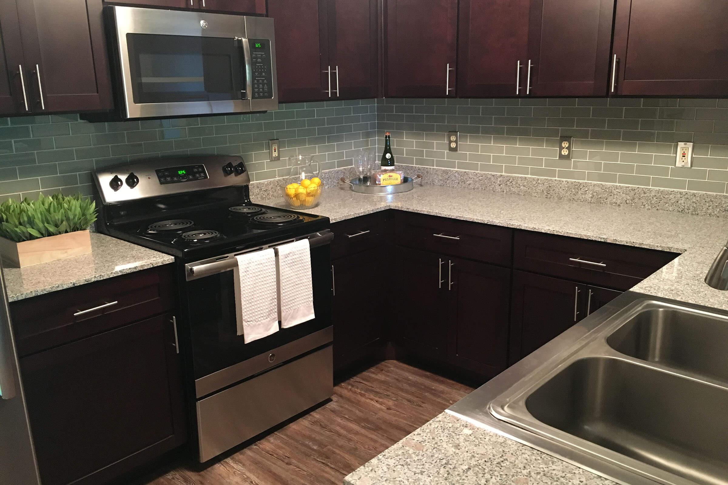 a modern kitchen with stainless steel appliances