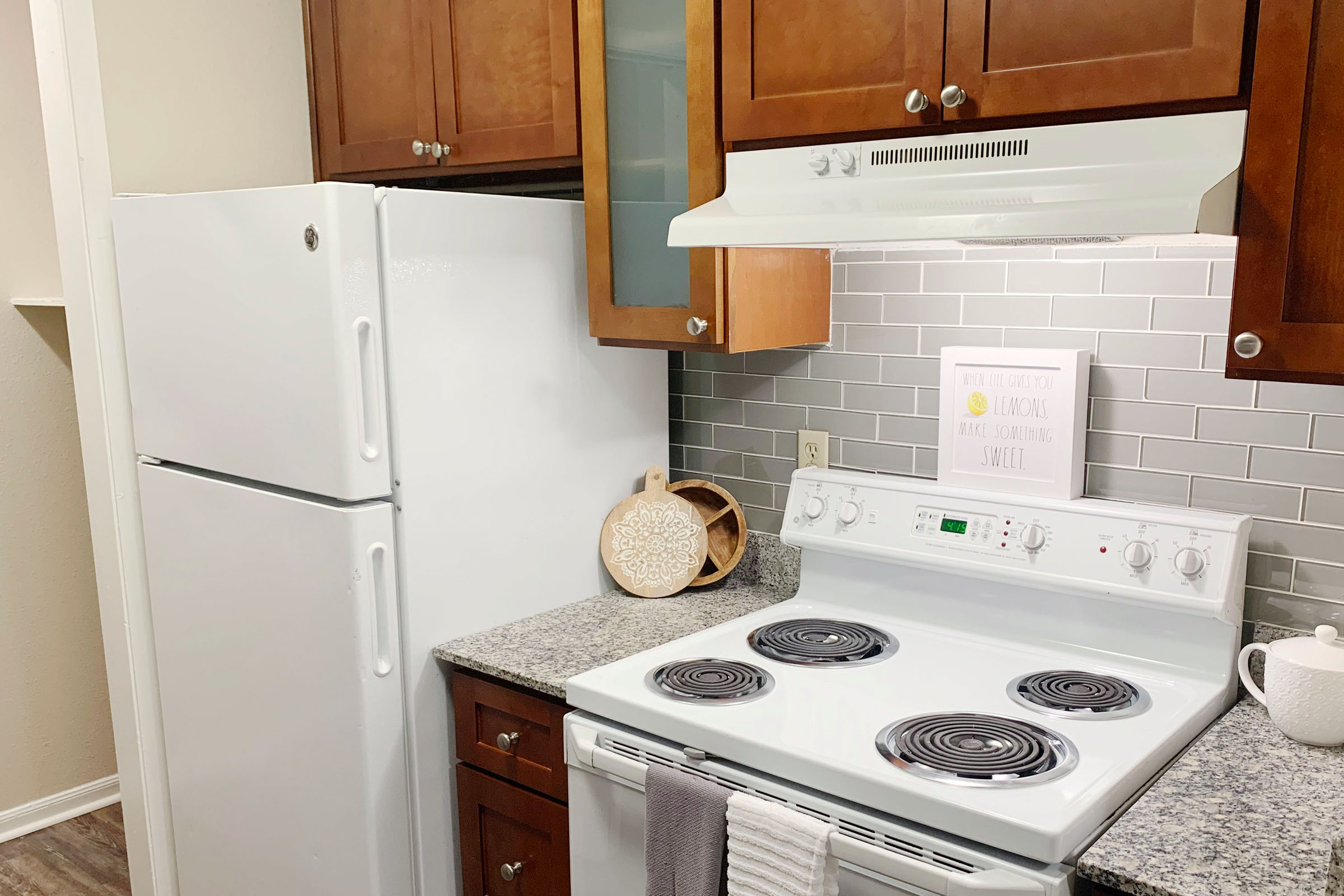 a kitchen with a stove top oven sitting inside of a refrigerator