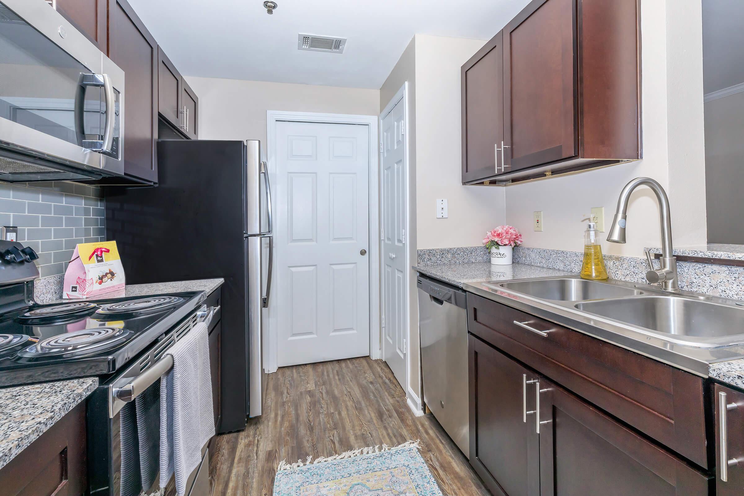 a large kitchen with stainless steel appliances