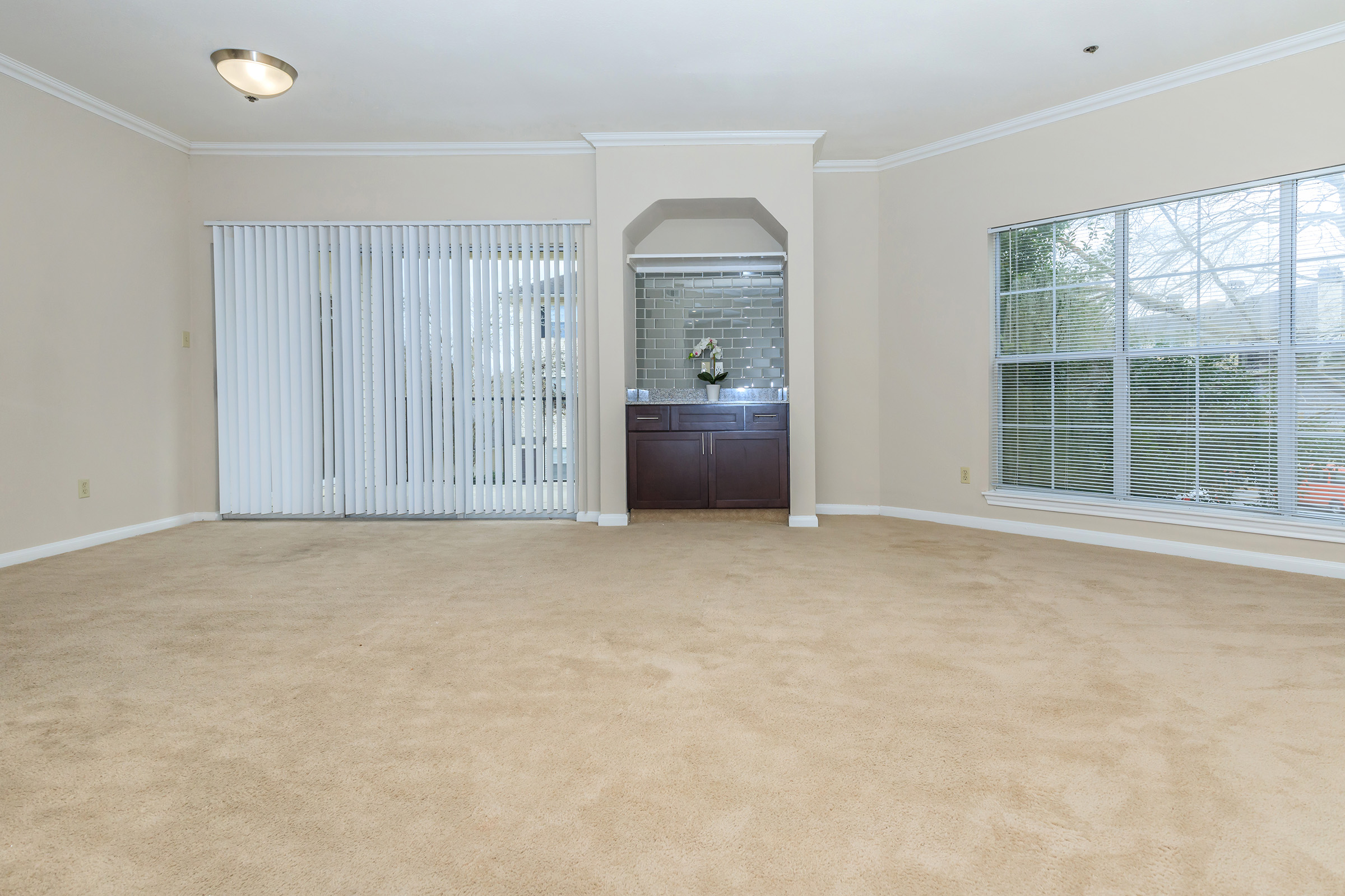 a room filled with furniture and a large window