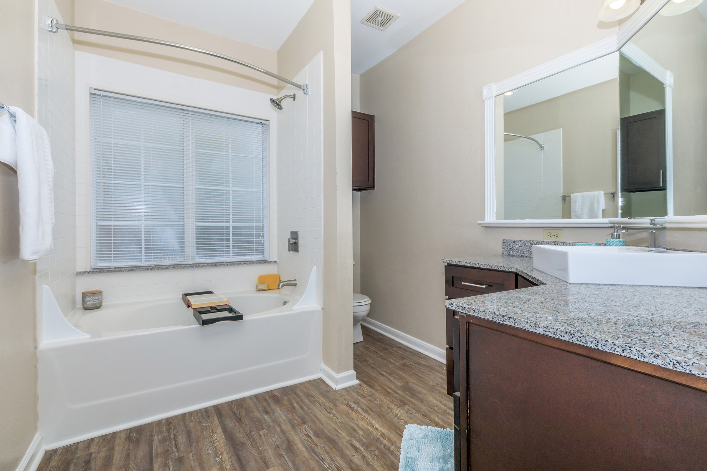 a kitchen with a sink and a mirror