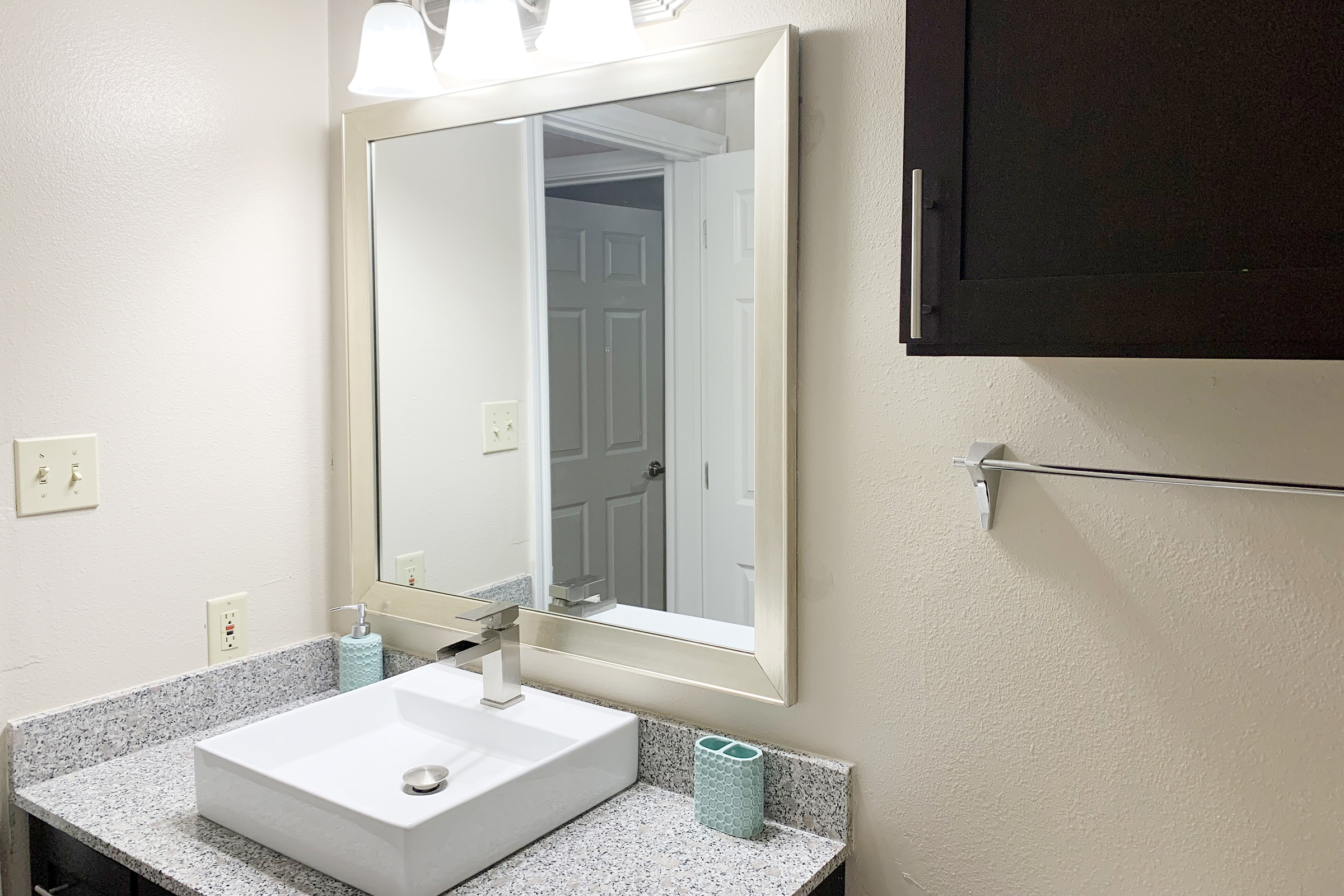 a double sink and large mirror