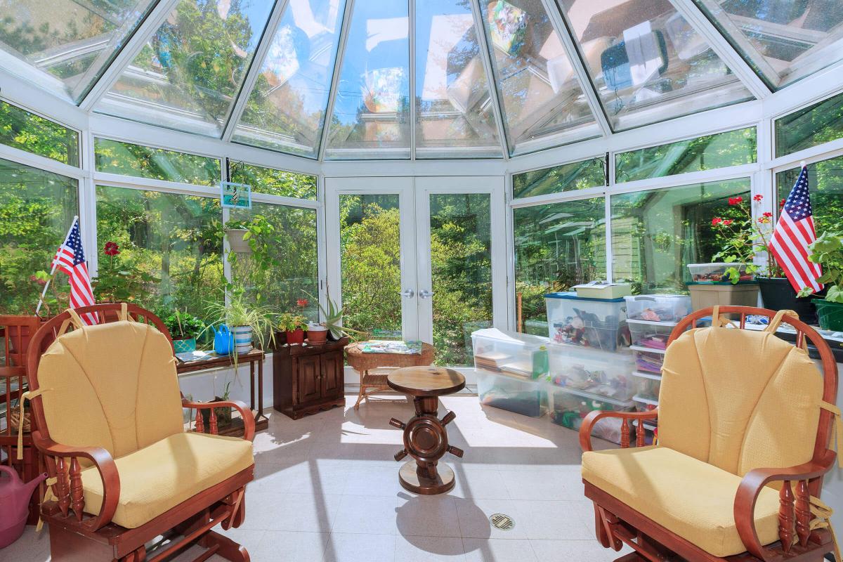 a living room filled with furniture and a large window