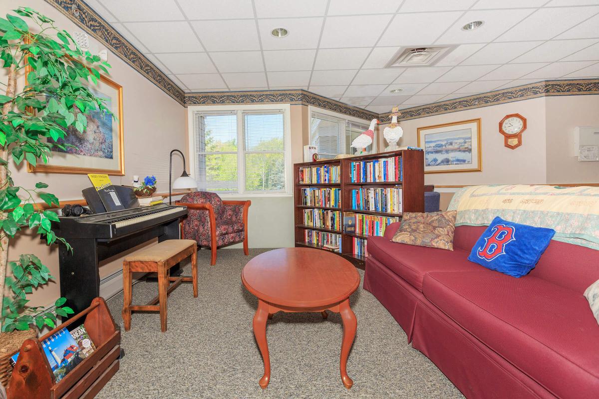 a large red chair in the living room