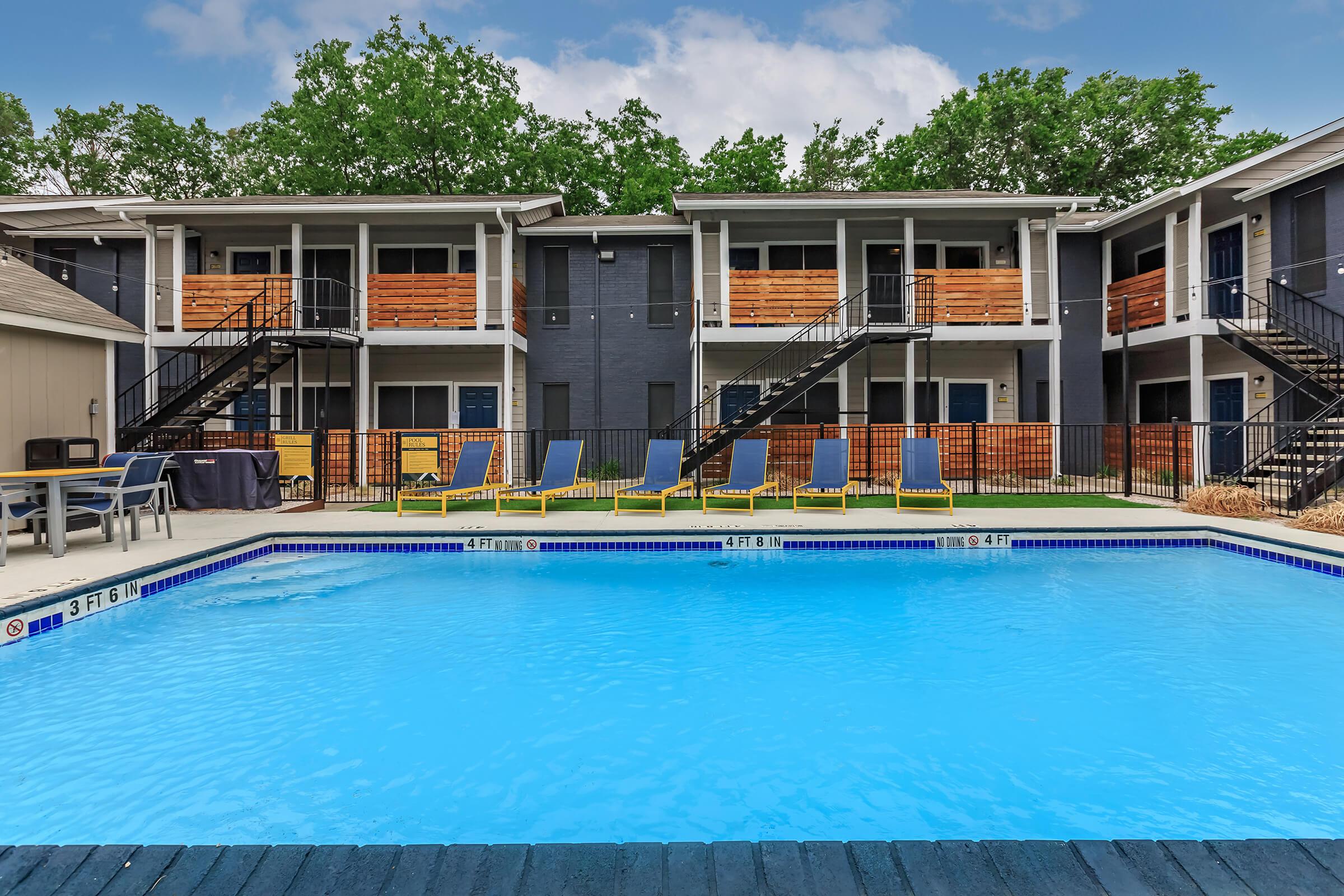 a large pool of water in front of a house