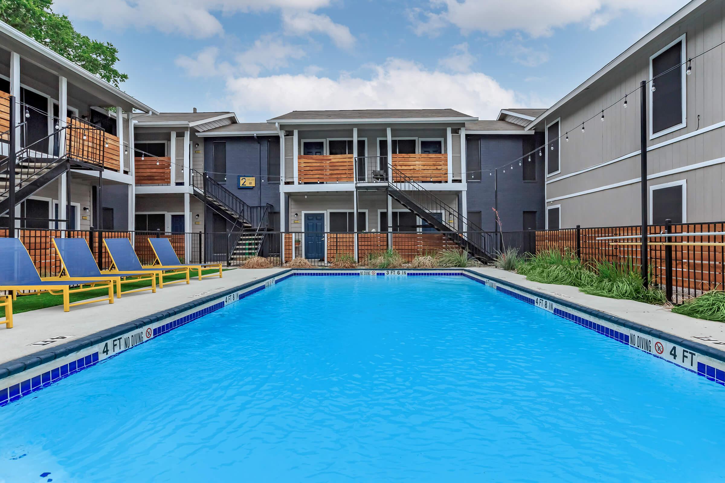 a large pool of water in front of a building