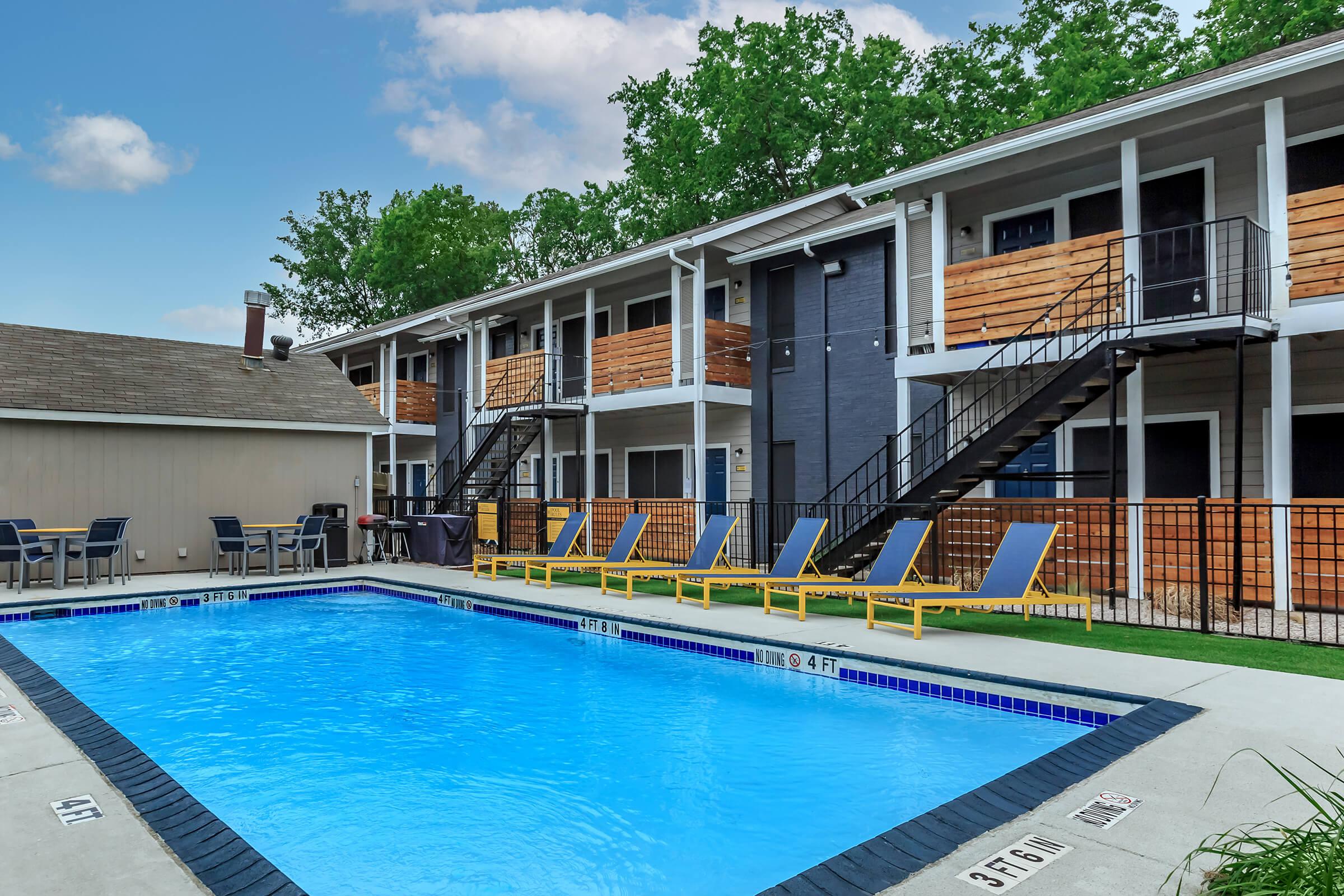 a large pool of water in front of a house