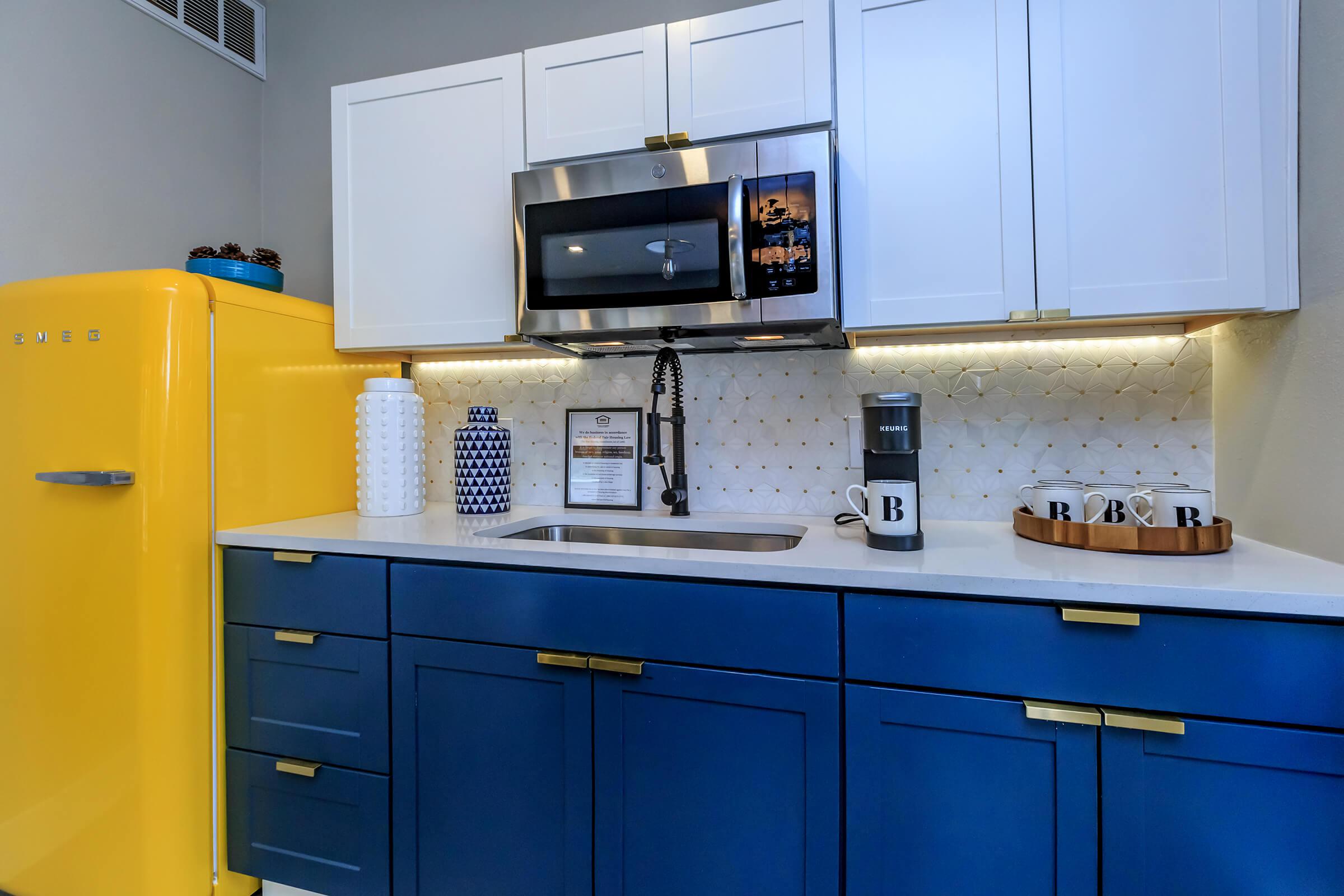 a kitchen with a stove and a refrigerator