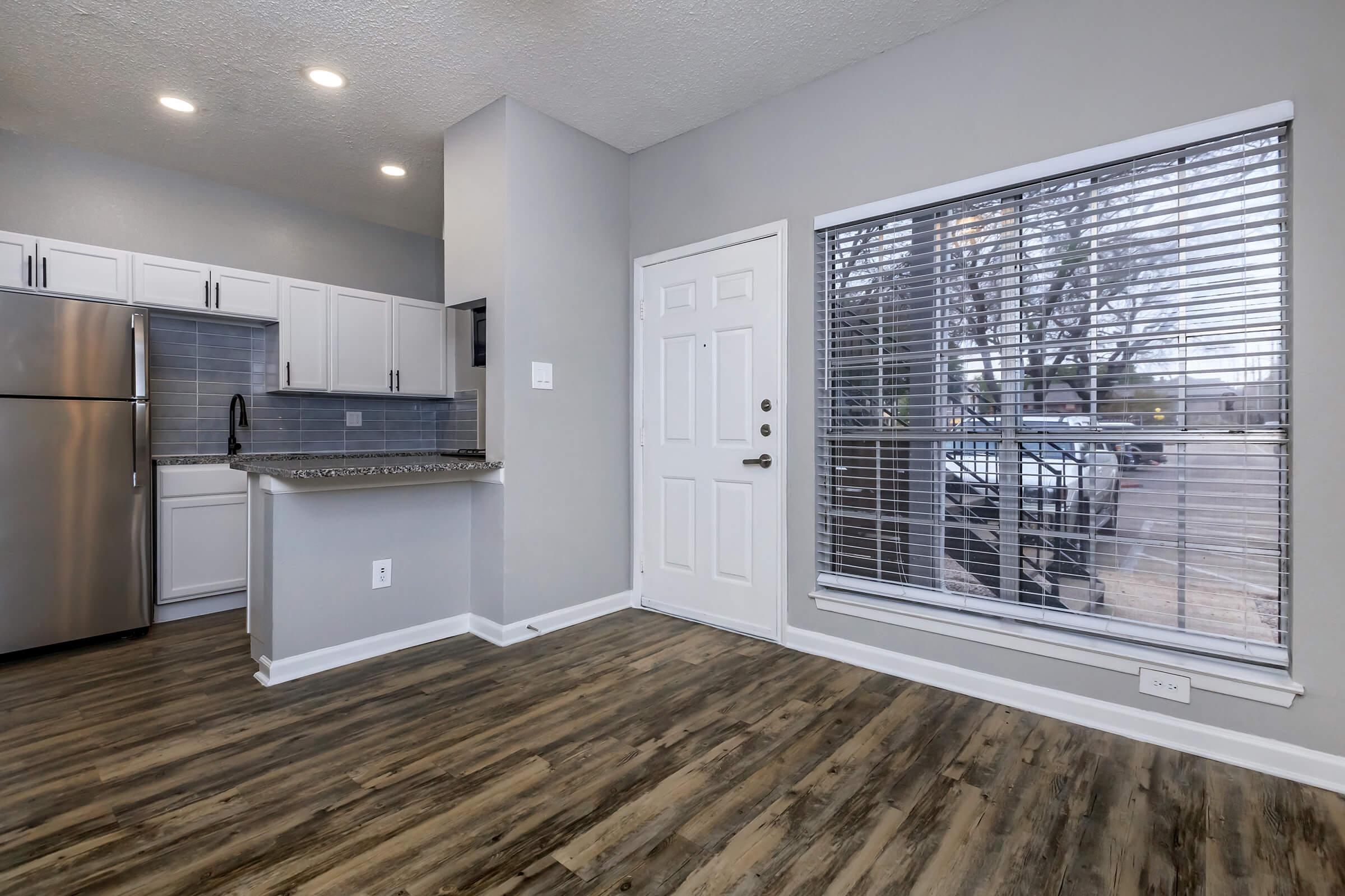 a kitchen with a large window