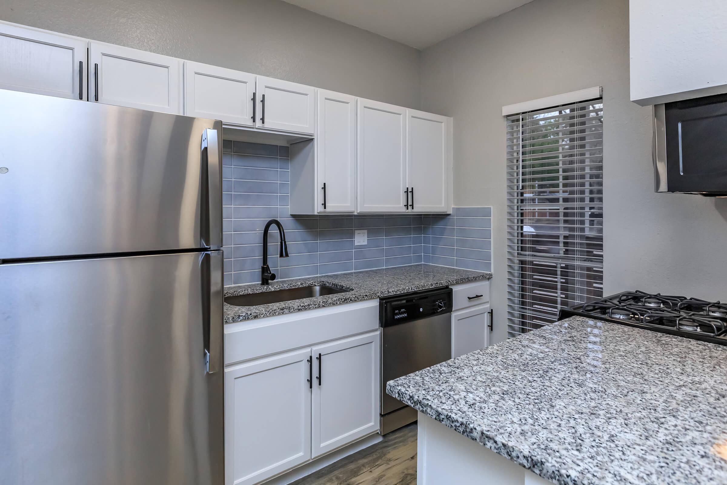 a stainless steel refrigerator in a kitchen