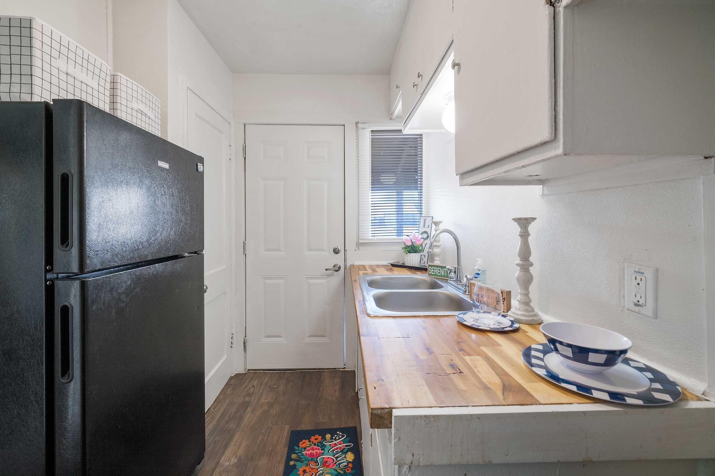 a kitchen with a stove and a refrigerator