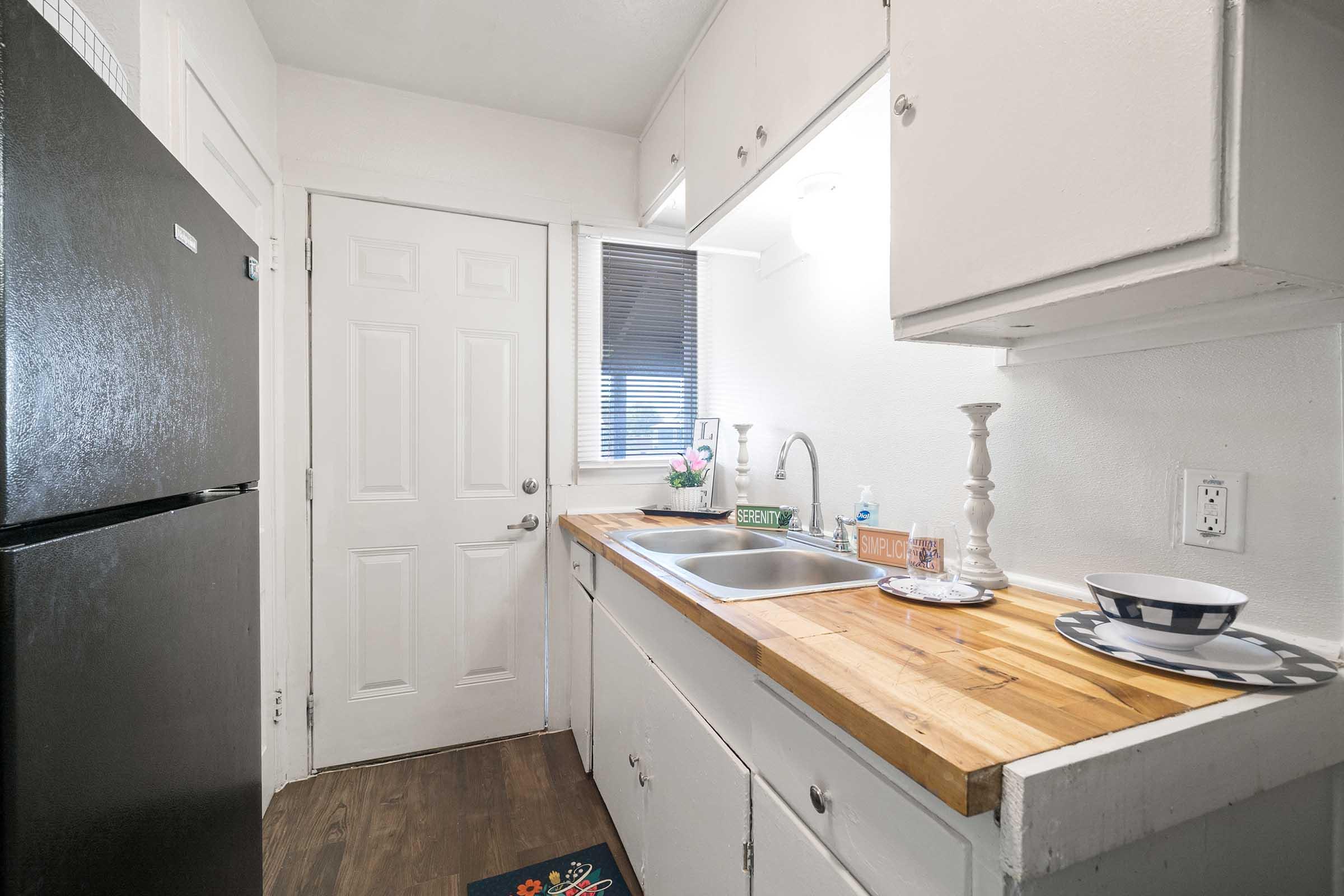 a kitchen with a sink and a window