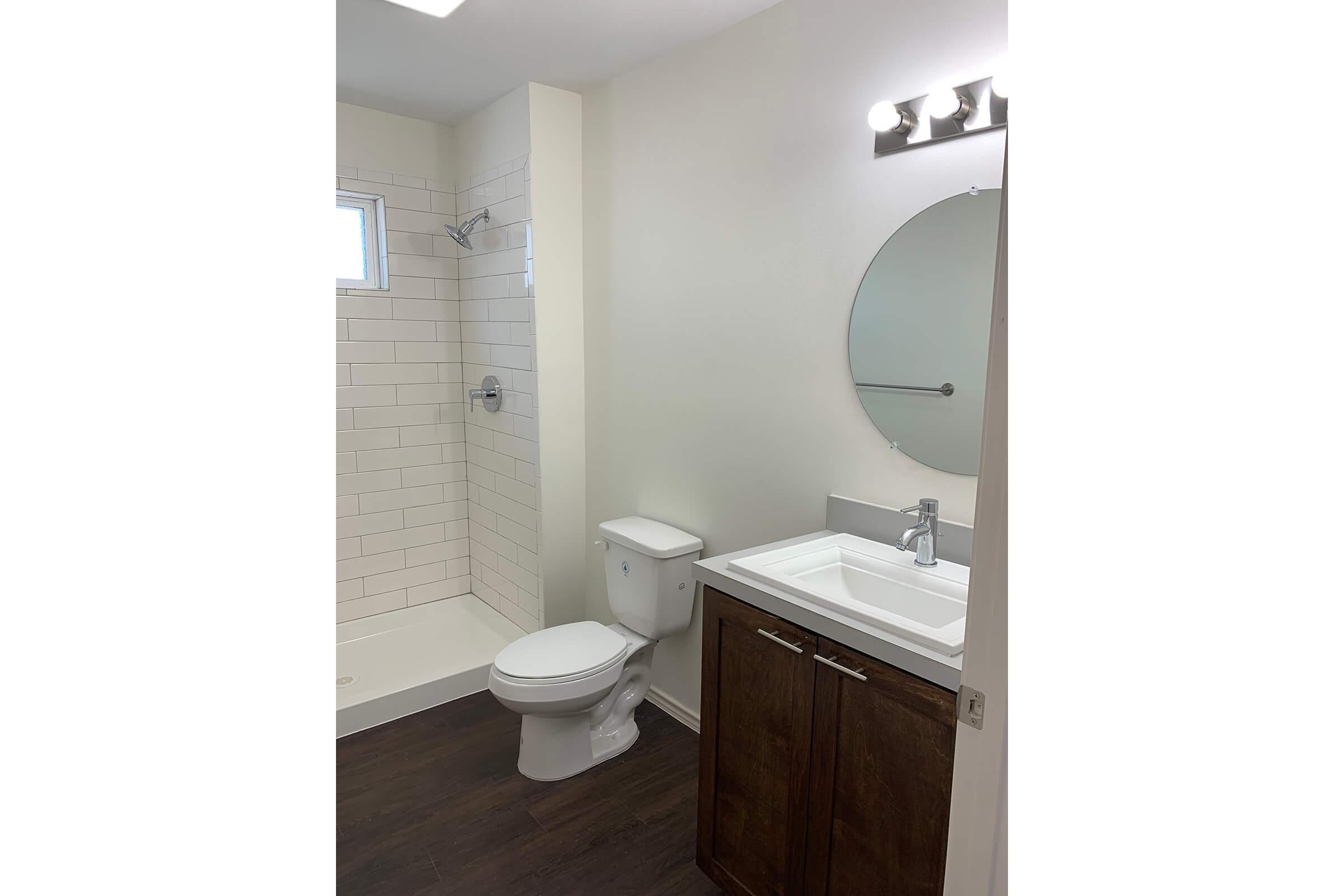 a white sink sitting next to a door