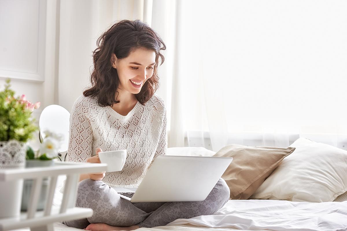 a woman sitting on a bed