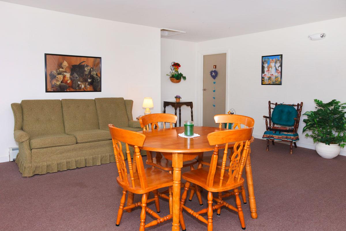 a living room filled with furniture and a table