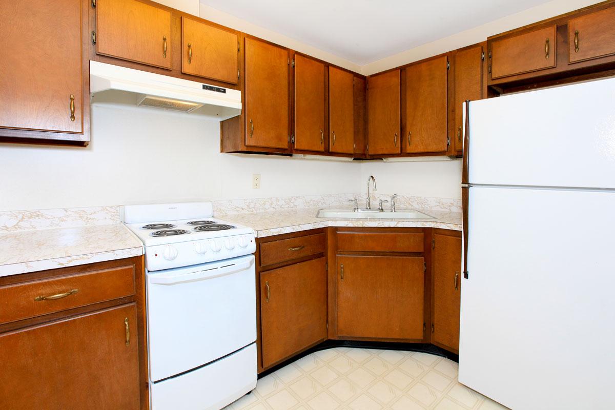 a kitchen with a stove and a refrigerator