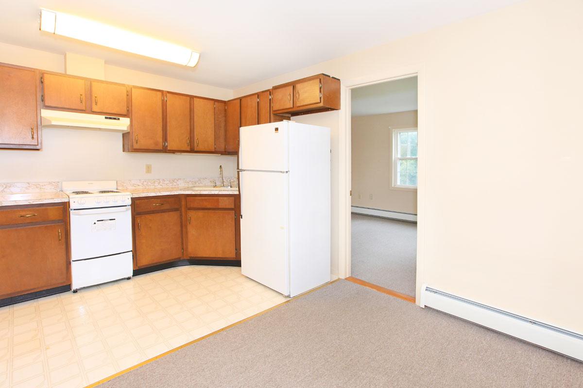 a large white refrigerator in a kitchen