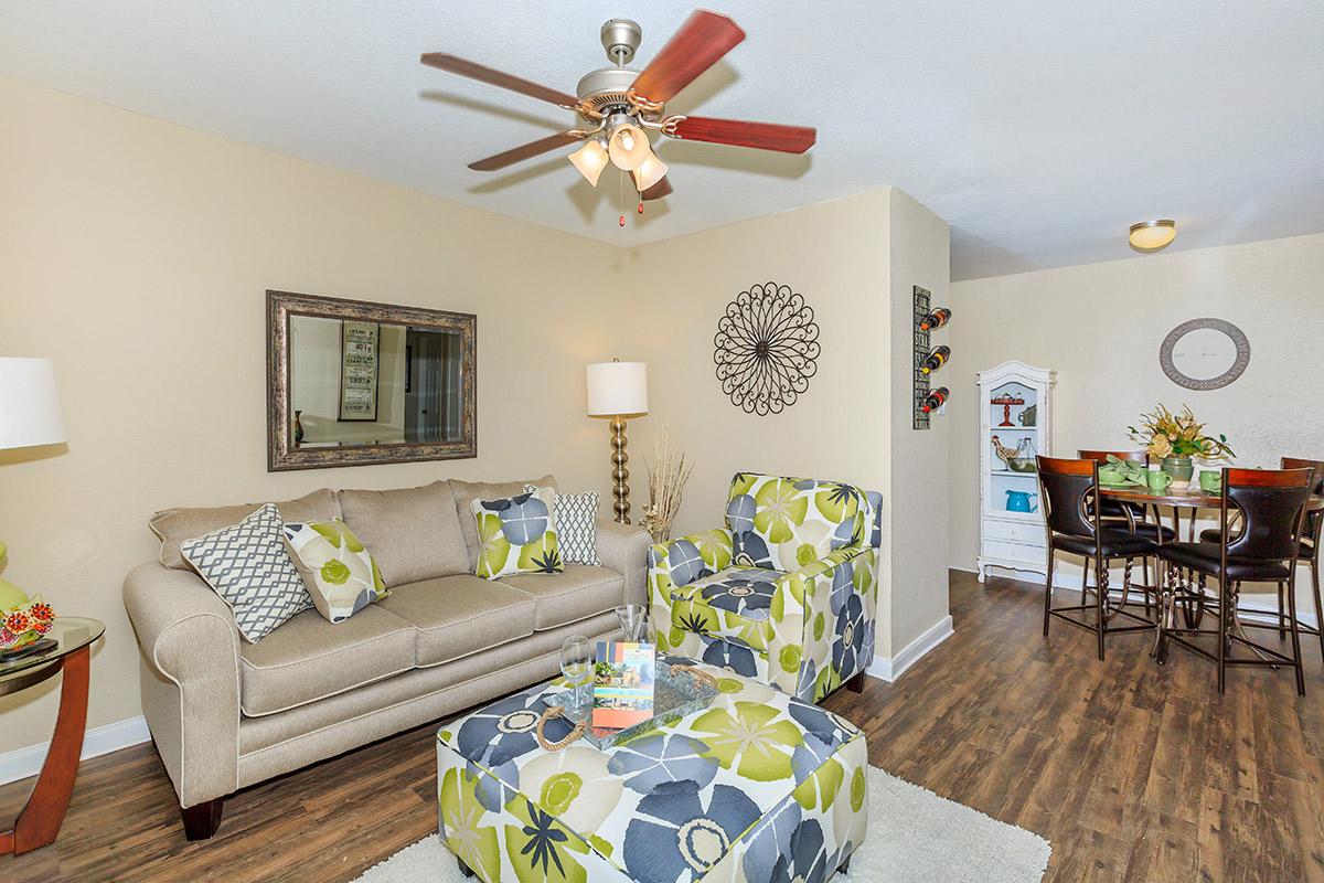 a living room filled with furniture and a table