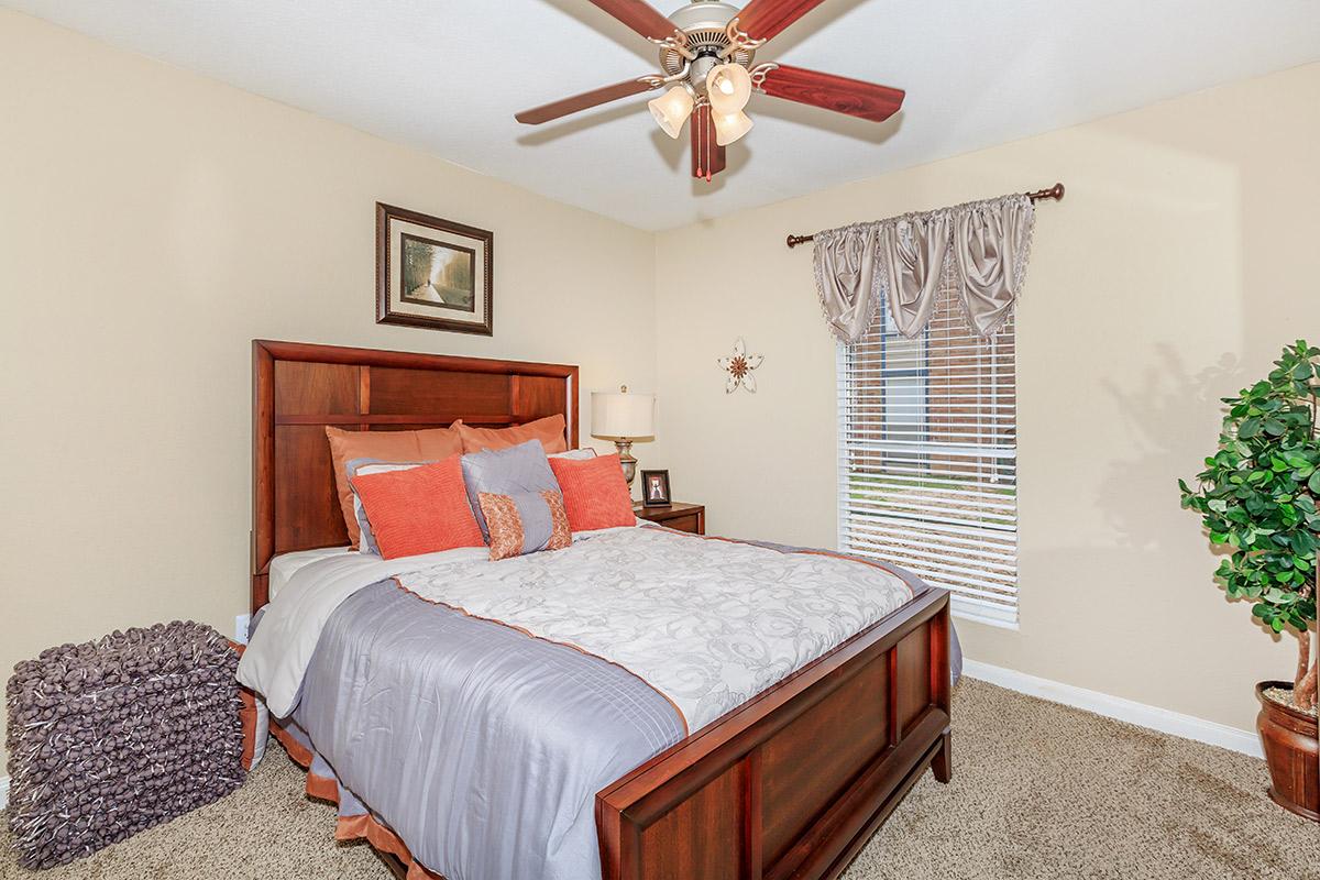 a bedroom with a bed in a room