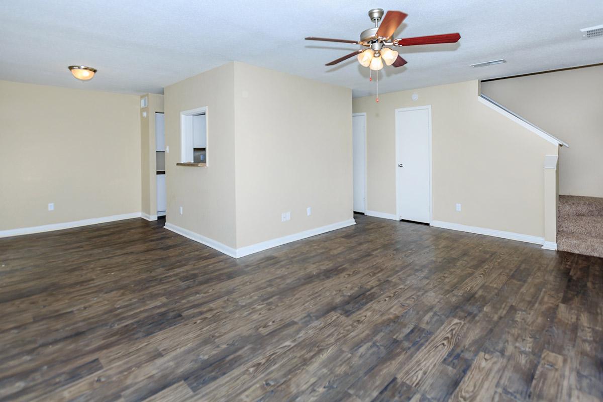 a large white building with a wooden floor