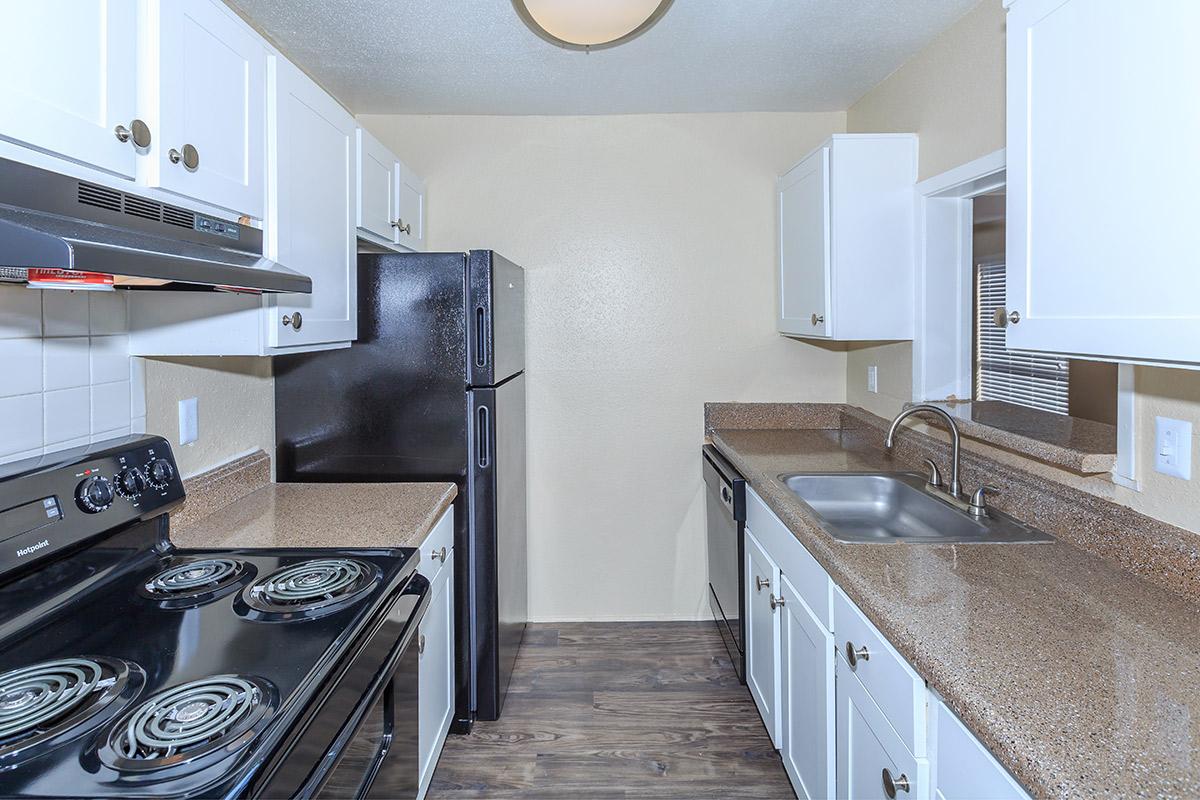 a kitchen with a stove top oven
