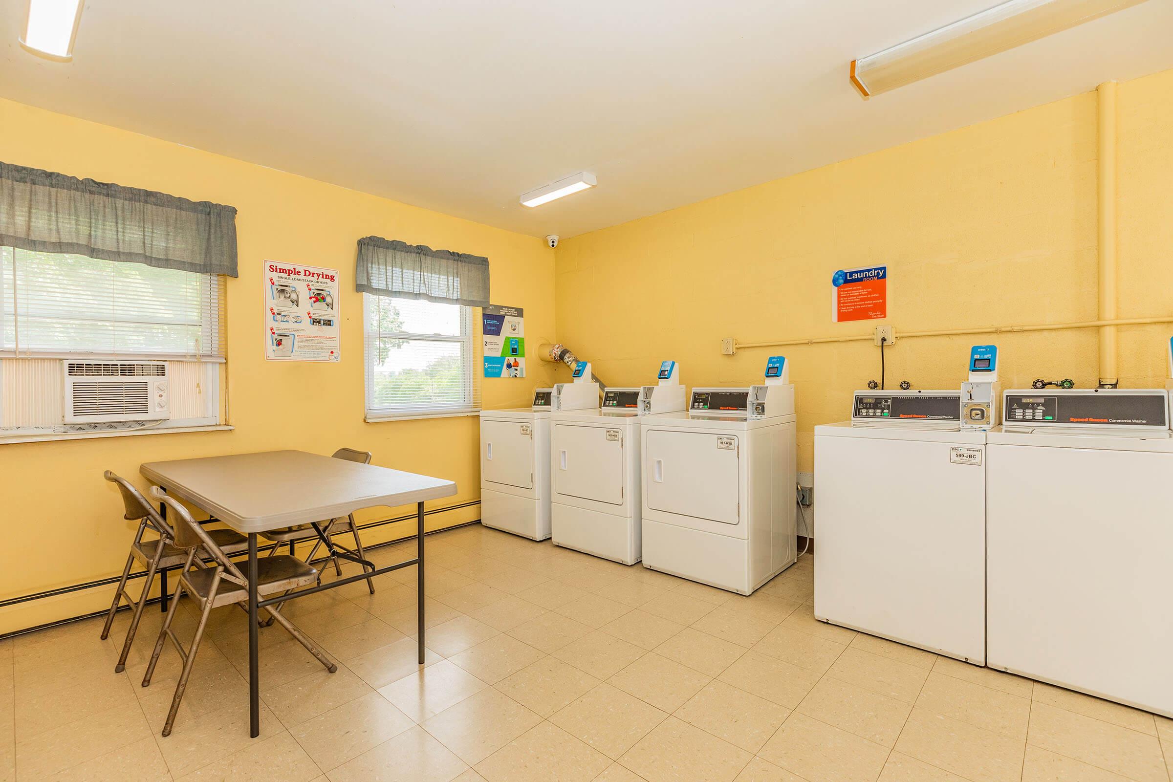 a kitchen with a table in a room