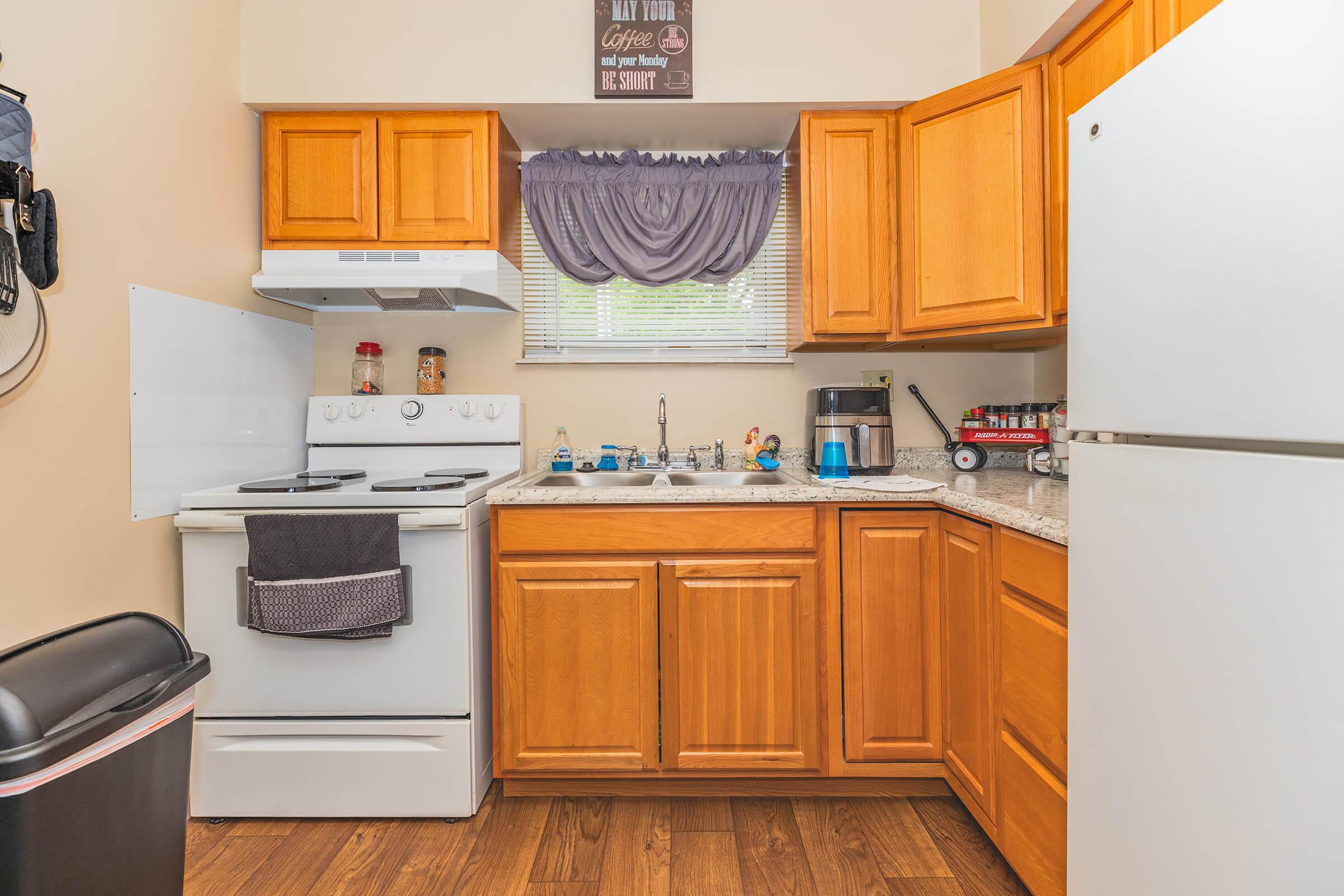 a kitchen with a stove and a refrigerator