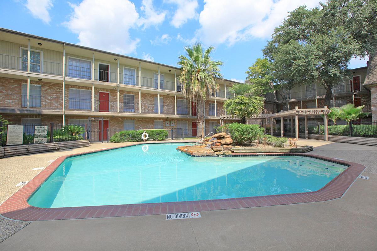 a pool in front of a building