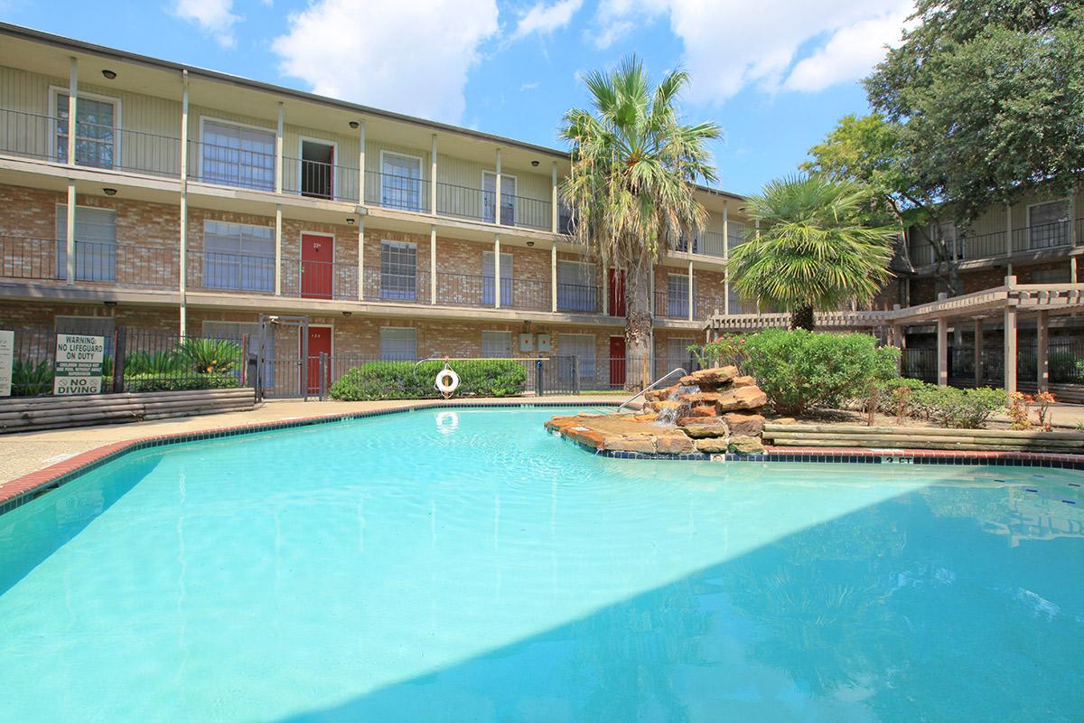 a large pool of water in front of a building