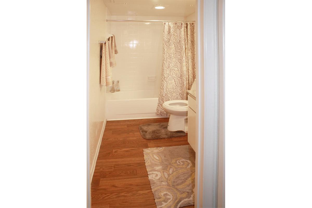 a white tub sitting next to a door