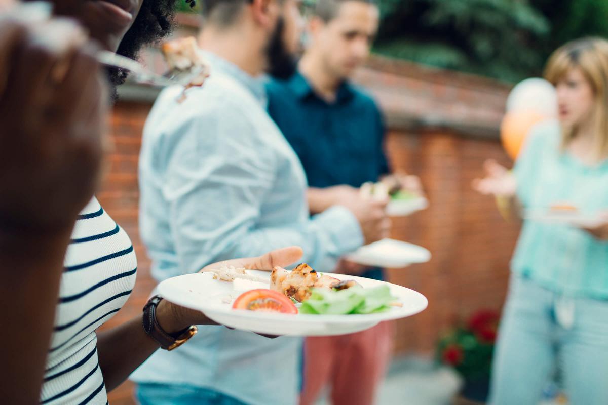 Unrecognizable People Eating At Barbecue Party iStock-474522384.jpg