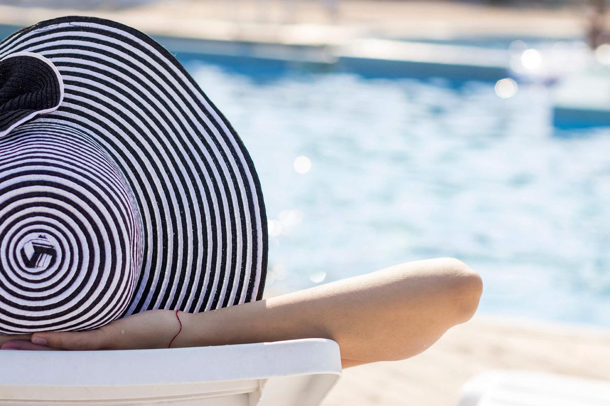 girl with hat lounging- iStock_000045731952_Large.jpg