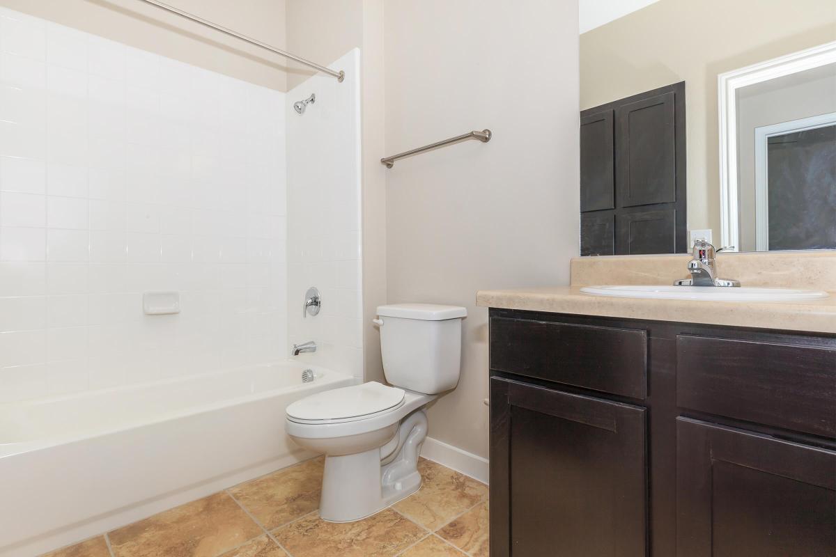 a large white tub sitting next to a sink